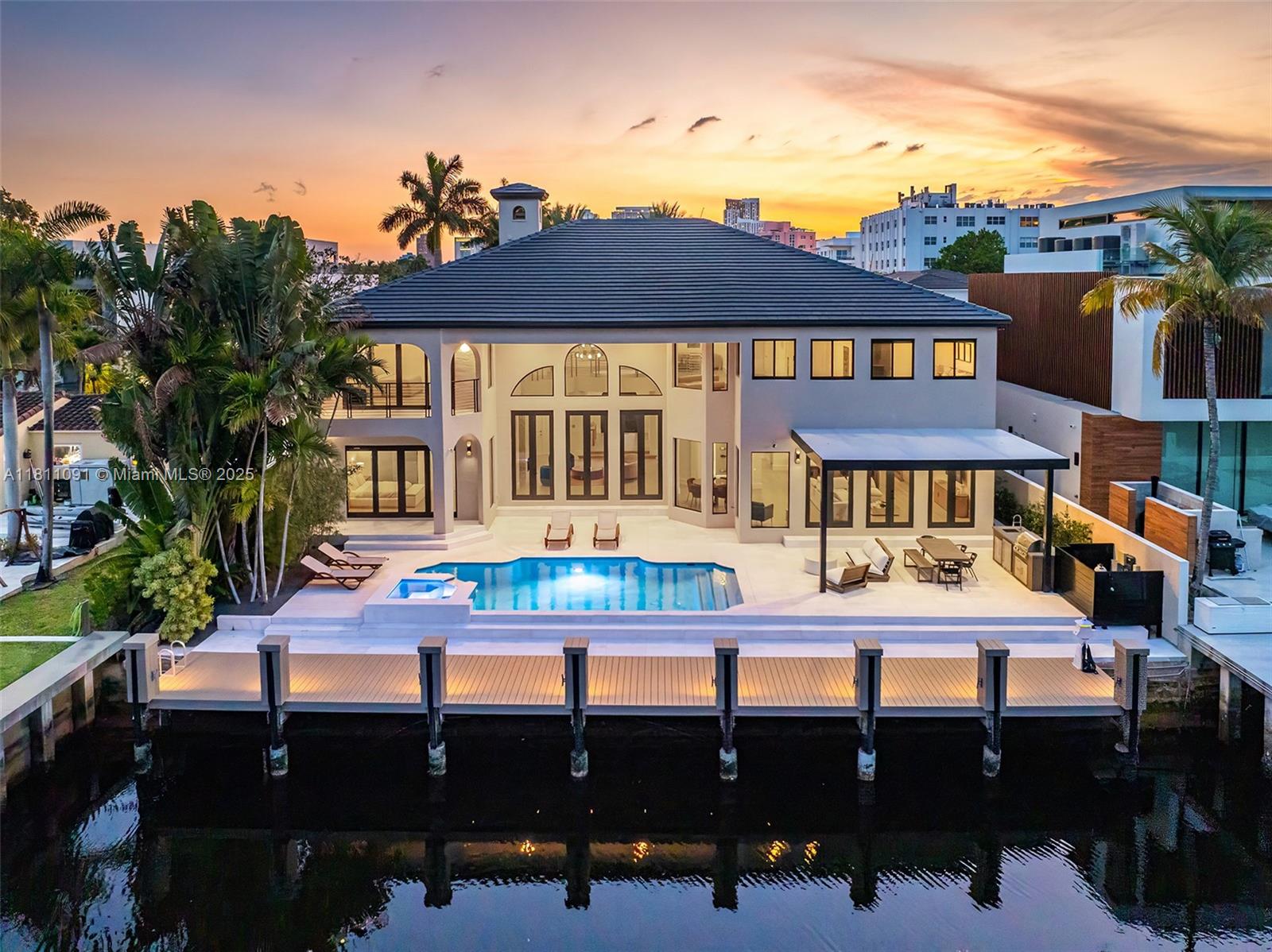 Unrivaled waterfront luxury awaits at this Fort Lauderdale estate, boasting 80 feet of deep-water frontage with no fixed bridges for direct ocean access. Beyond a grand motor court, 5,500 sq ft of newly renovated interiors seamlessly blend modern elegance with timeless comfort, all framed by panoramic water views.
Expansive living spaces flow into a sprawling backyard oasis that beckons with a sparkling pool, lush tropical landscaping, and a private dock for your yacht. All of this is just moments from vibrant Las Olas Boulevard and the Atlantic Ocean, offering elegance, adventure, and convenience in equal measure.