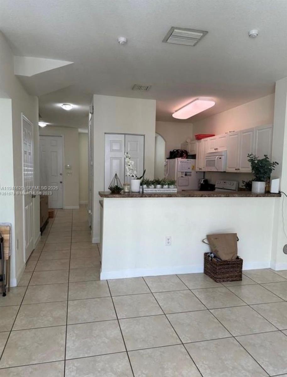 Investment Opportunity!  this unit has 2 bedroom 2 and a half bathroom in the upstairs area.  Each bedroom has its own bathroom.  It is in the prestigious Fiji Neighborhood in Homestead with amenities such as:  pool, playground and walking trails.  It is near the Baptist Hospital, Homestead Air Reserve Base, shopping, dining, top-rated schools.  The house is rented until April 2026 for $2,100 which makes a good return.  The tenant would like to renew the lease.