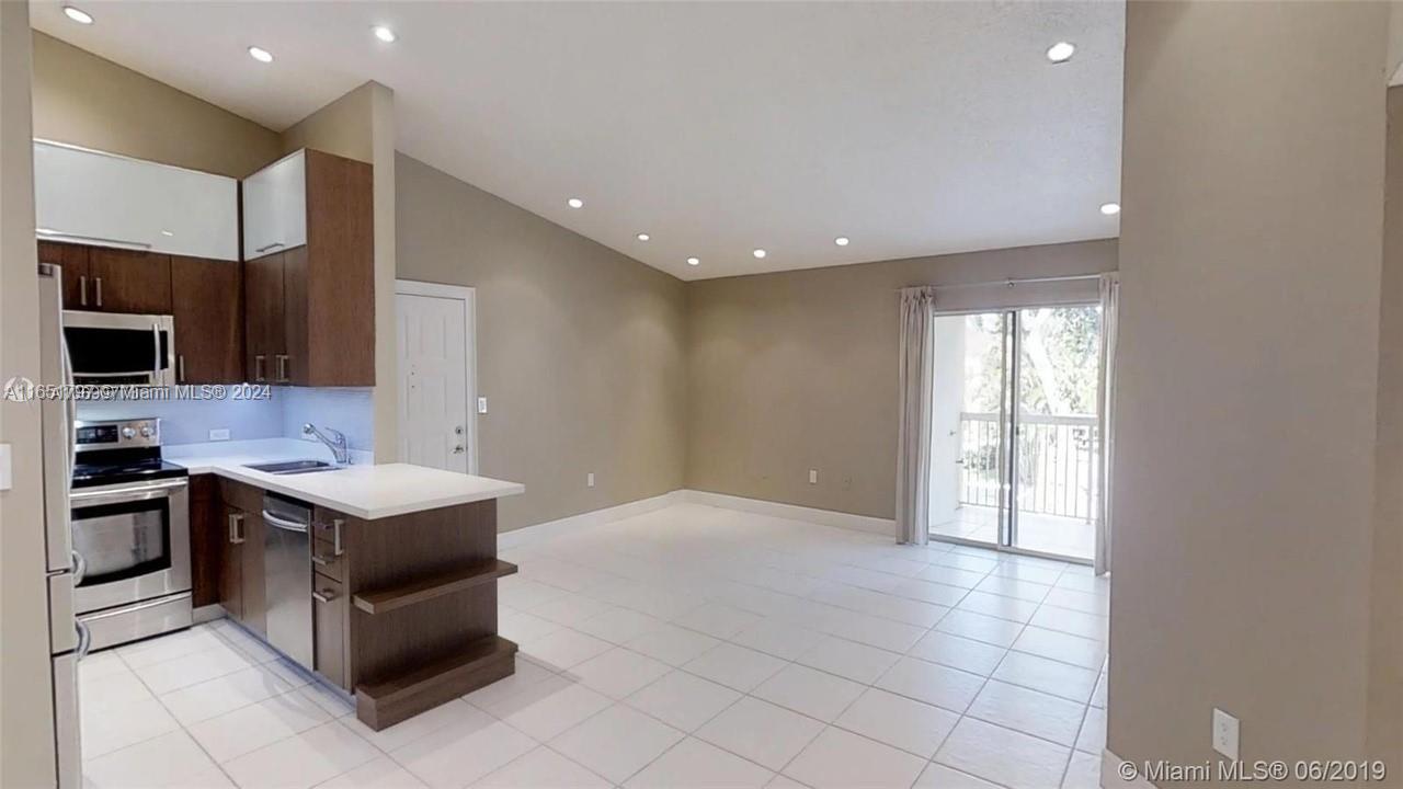 3 bedrooms and 2 bathroom huge apartment with nestled within a meticulously maintained gated community in Doral. The stainless steel appliances and the beautiful countertops add a touch of elegance to the space. Neutral stone tile flooring spans throughout, creating a seamless and sophisticated aesthetic. Enjoy the convenience of a private washer/dryer laundry and storage room, ensuring your needs are met. Indulge in the community's clubhouse, basketball, tennis, volleyball, a gym, two community pools, a Jacuzzi, sauna, and playground. This residence is ideally situated close to major highways, a shopping center, and within walking distance to an A+ school. Enjoye the prestigious Doral Park Country club
