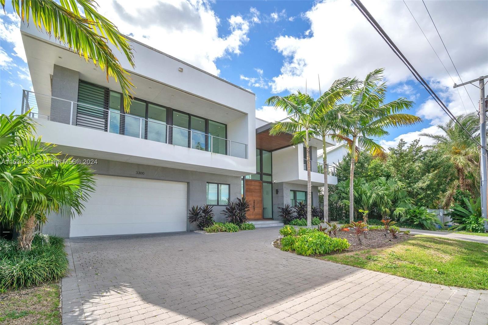 Modern waterfront masterpiece! Ideal primary or second/third home, ready for those seeking the finest things in life. Newer composite dock fit for a 70'+ yacht, this boaters paradise is easy to navigate. With zero fixed bridges, deep water and wide canal access, you'll be on the ocean or cruising the intracoastal in no time. Upon your return, enjoy in a dip in your private heated pool & spa while your steaks sizzle on the custom built in BBQ grill. Special features include custom temperature controlled 125+ capacity wine fridge, elevator, 8 seat cinema, smart control in all rooms for lights & blinds, TV's & built in custom bedroom furniture & wall finishings of the finest quality, a primary closes fit for royalty. Truly turnkey, newer construction home ready for the most discerning buyer.