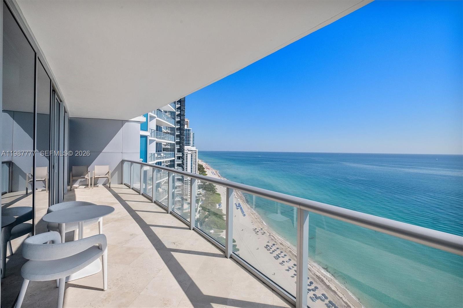 Experience elevated oceanfront living at Jade Beach in Sunny Isles Beach. This stunning 27th-floor residence offers breathtaking & unobstructed views of the Atlantic Ocean through floor-to-ceiling glass and expansive terraces. Unit 2702 features a spacious layout with private elevator entry, offering 2 bedrooms, 3 full bathrooms, and a den that can easily function as a third bedroom or home office. The desirable split floor plan provides optimal privacy, while the open-concept living and dining areas are filled with natural light and seamlessly connect to oversized terraces—perfect for indoor-outdoor living and entertaining. The gourmet kitchen is equipped with premium appliances & sleek cabinetry, ideal for both casual dining and hosting. The primary suite is a private retreat with direct ocean views, a spa-inspired bathroom, and ample closet space. Jade Beach delivers a full-service, resort-style lifestyle including beachfront service, oceanfront infinity pools, state-of-the-art fitness center, spa, cafe, concierge, and 24-hour security. Located in the heart of Sunny Isles Beach, just minutes from Bal Harbour Shops, fine dining, and top-rated schools. A rare opportunity to own in one of Sunny Isles’ premier oceanfront buildings with flexible living space and exceptional views. NO WEEKEND SHOWINGS AS PER ASSOCIATION.