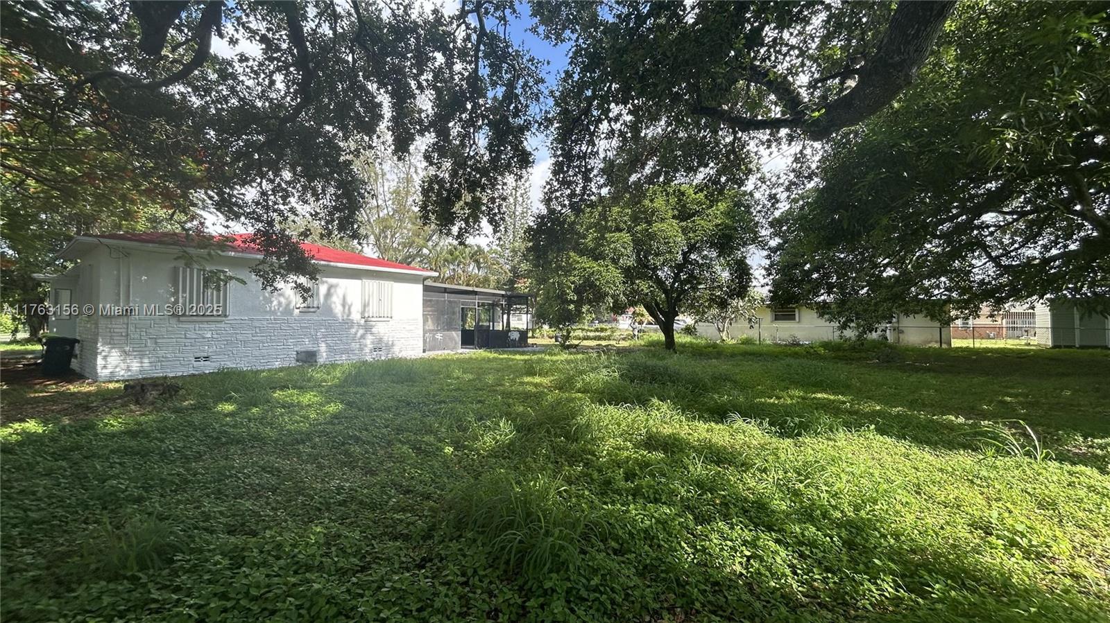 Discover this charming home at 205 Seaman Ave in Opa Locka, FL. This residence features a welcoming layout with ample natural light throughout. The spacious living area flows seamlessly into a well-appointed kitchen. 
Enjoy the comfort of multiple bedrooms and a cozy outdoor space appropriate for relaxation. Conveniently located near local amenities and transportation, this property offers a wonderful opportunity to own a huge piece of Opa Locka. 
Including 3 bedrooms and 2 bathrooms, great Florida room and covered patio, you are going to enjoy the 1341 sqft that composes this House. Located on a great corner on 9,286 SqFt lot with century old trees, 2 huge Mango trees and more.