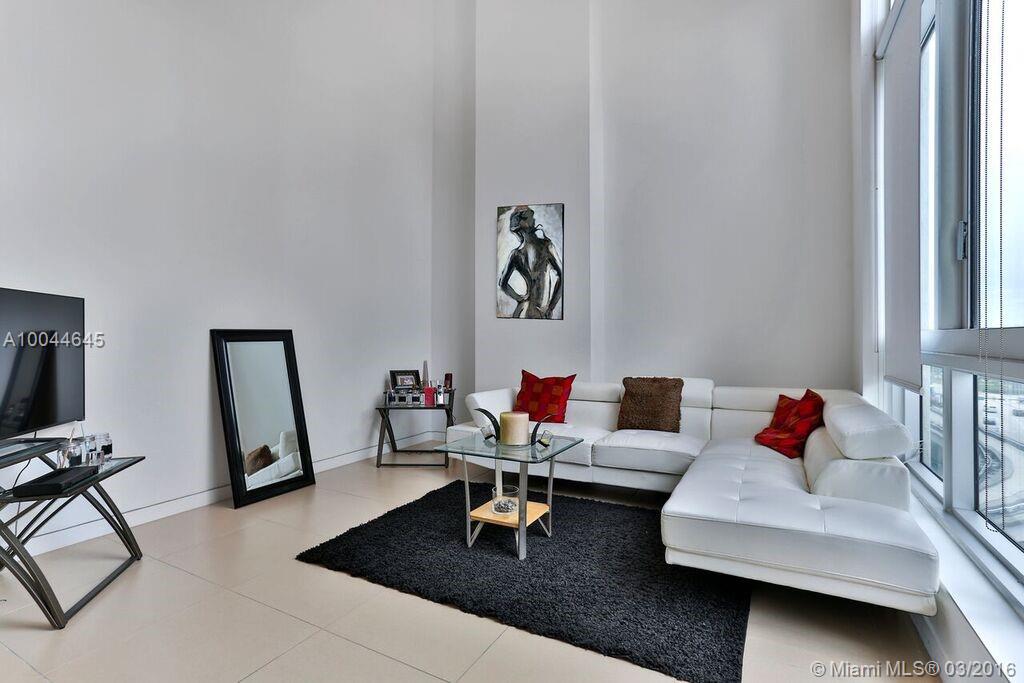 Fabulous water views from this 19' 4" high ceiling Loft with porcelain tiles throughout. East exposure, 1 bedroom, 1 1/2 baths, Italian cabinetry, granite countertops, stainless steel appliances, washer and dryer in unit. Water, cable, internet and telephone included. One assigned parking space on the same floor of your loft.