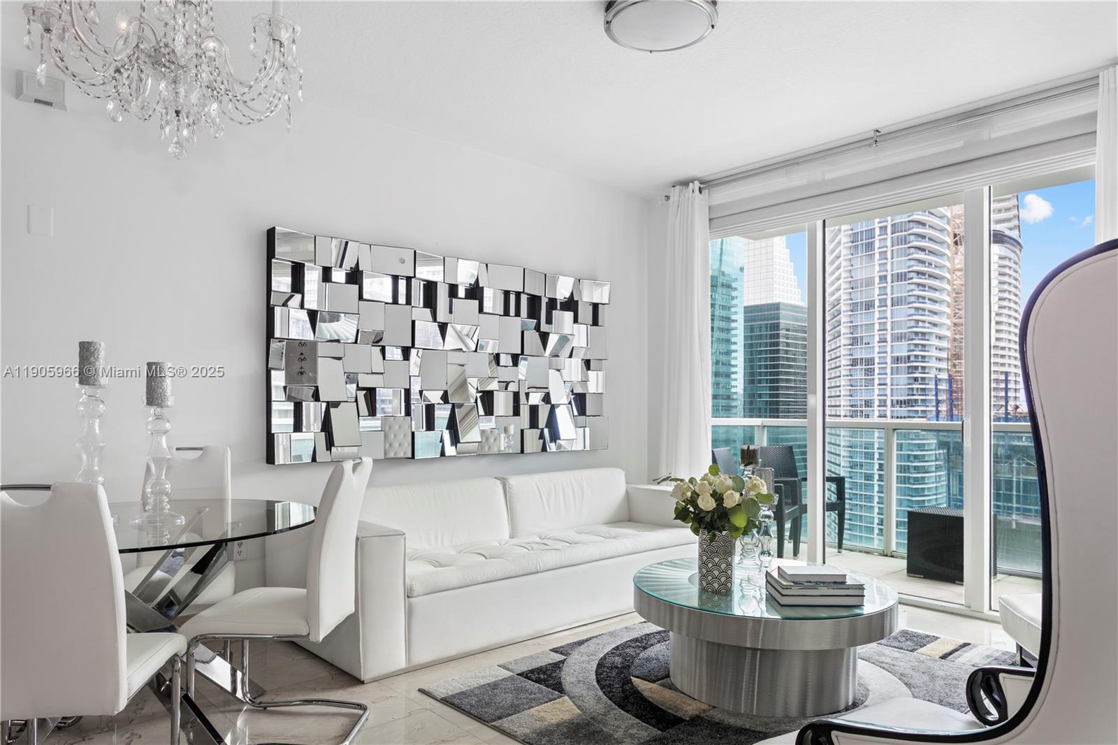 Experience elevated Brickell living in this sun-filled 3-bedroom, 2.5-bath corner residence at Brickell on the River North. Perched on the 40th floor, it offers sweeping bay, river, and city views through floor-to-ceiling impact windows and two private balconies. Featuring marble floors, a modern open layout, and premium finishes. Enjoy resort-style amenities including a riverfront pool, state-of-the-art fitness center and spa, sauna, 24-hour concierge, and valet service. Steps from Brickell City Centre, Metromover, Whole Foods, and Miami’s top dining destinations. Includes assigned parking and storage. Pet-friendly and easy to finance.