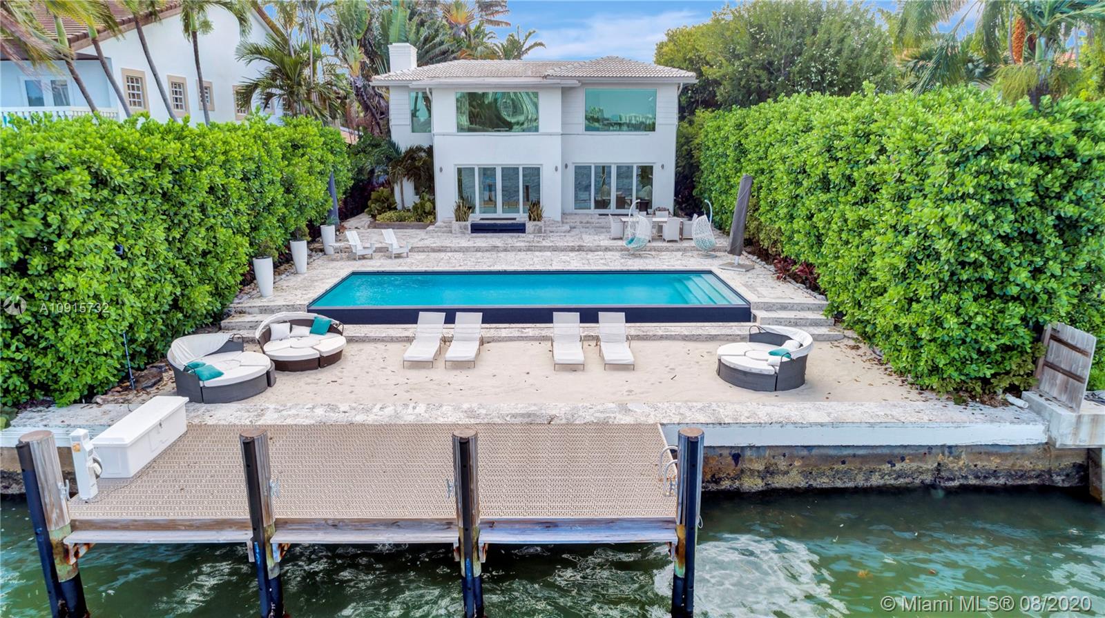 Welcome to 803 E Dilido Drive: A Contemporary Beach House on the Venetian Islands. This home sits on a 10,500 SqFt lot with 60 Ft of Water Frontage, expansive wide bay views and a large backyard with beach area and infinity edge pool; perfect for outdoor entertaining and relaxing. Inside, you have Carrera marble floors throughout, spacious kitchen area, formal / informal living spaces and 2 Bedrooms. Upstairs you have the Master Suite, featuring dual bathrooms / closets, sitting area with office and picturesque windows overlooking Biscayne Bay. Master can be reconverted into 2 Bedrooms. Enjoy the lush tropical foliage throughout the property for the utmost privacy. Walking distance to the Standard Hotel & Spa, Sunset Harbour and top area restaurant's, shopping and gyms.