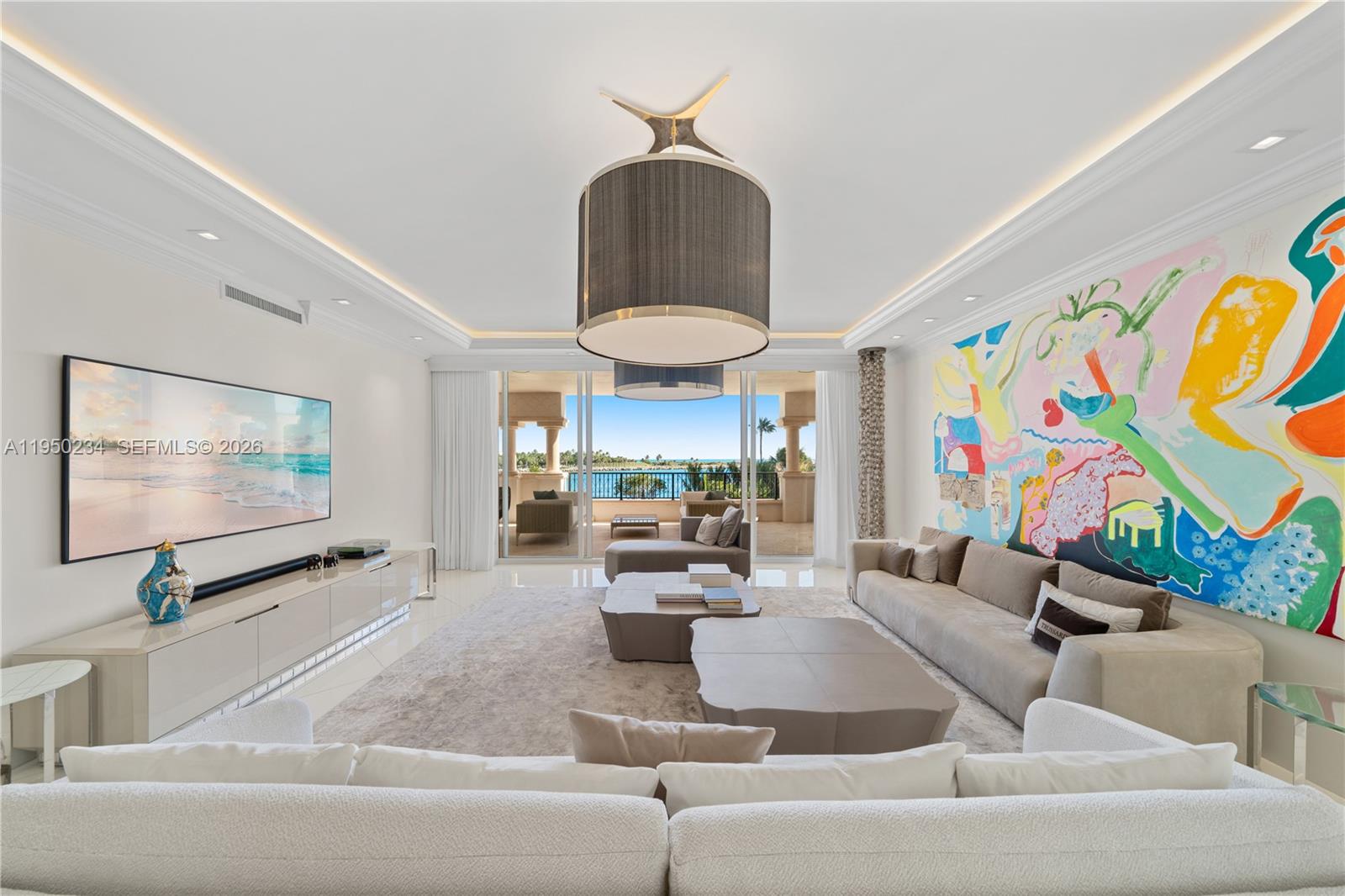 SOUTH-EAST CORNER RESIDENCE ON FISHER ISLAND WITH SWEEPING VIEWS OF MIAMI BEACH, GOVERNMENT CUT, AND THE OCEAN AT THE NEW FULL-SERVICE PALAZZO DEL MARE DESIGNED BY AGUSTO BUSNELLI! Private elevator foyer leads into this 4 bedroom + 4.5 bath residence spanning 3,690 SF of interior living space with elegant wood & white large glass porcelain floors  & over 1,000 SF of wraparound terraces. Gourmet kitchen with breakfast area equipped with a Sub-Zero refrigerator & wine fridge, Miele dishwasher, Gaggenau 2 ovens, stovetop & coffee maker. Oversized LG Washer & Dryer. Primary Bedroom with sunrise & ocean views. Expansive marble master bath with Waterworks fixtures, double vanities, soaking jet tub, steam shower & 2 toilet rooms. Automated window treatments. 2 assigned parking spaces, golf cart + Valet. Situated within a Boutique 5 star service building with only 27 residences. Enjoy world-class brand new Italian designed amenities including a private heated swimming pool, aperitivo bar, state-of-the-art fitness center, spa, sauna, steam rooms & a media room. Live the Relaxed & Sophisticated Fisher Island Lifestyle on 216 Acres featuring World-Class 5-Star Amenities including The Fisher Island Club, Vanderbilt Mansion Clubhouse, Spa, Top-rated Private School, 8 Restaurants, Golf Course, Aviary, 2 Marinas, New Beach & Yacht Club, 1-Mile Long Private Beach, Racquet Club with 17 Grand Slam Courts, 4 Pickleball & Padel Courts, Town Center with an Island Gourmet Market.