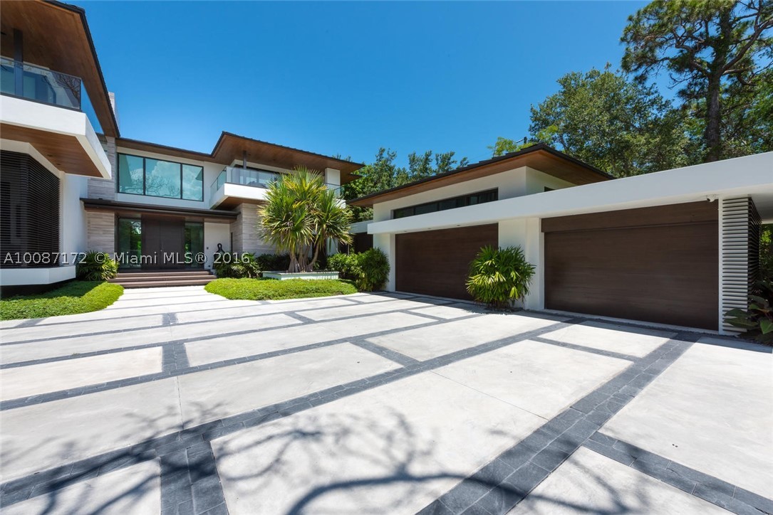 Stunning private residence of renowned architect & builder! 2016 construction with no expenses spared. Property features top-of-the-line materials and custom-finishes throughout including polished limestone floors, walnut wood door panels, 450 bottle wine cellar, electric blinds, Mia Cucina kitchen, home theater with 108" screen, heated pool, outdoor kitchen, terrace with automated screens, sauna in master bath, private outdoor terrace at master and so much more. Quiet street with very little traffic.