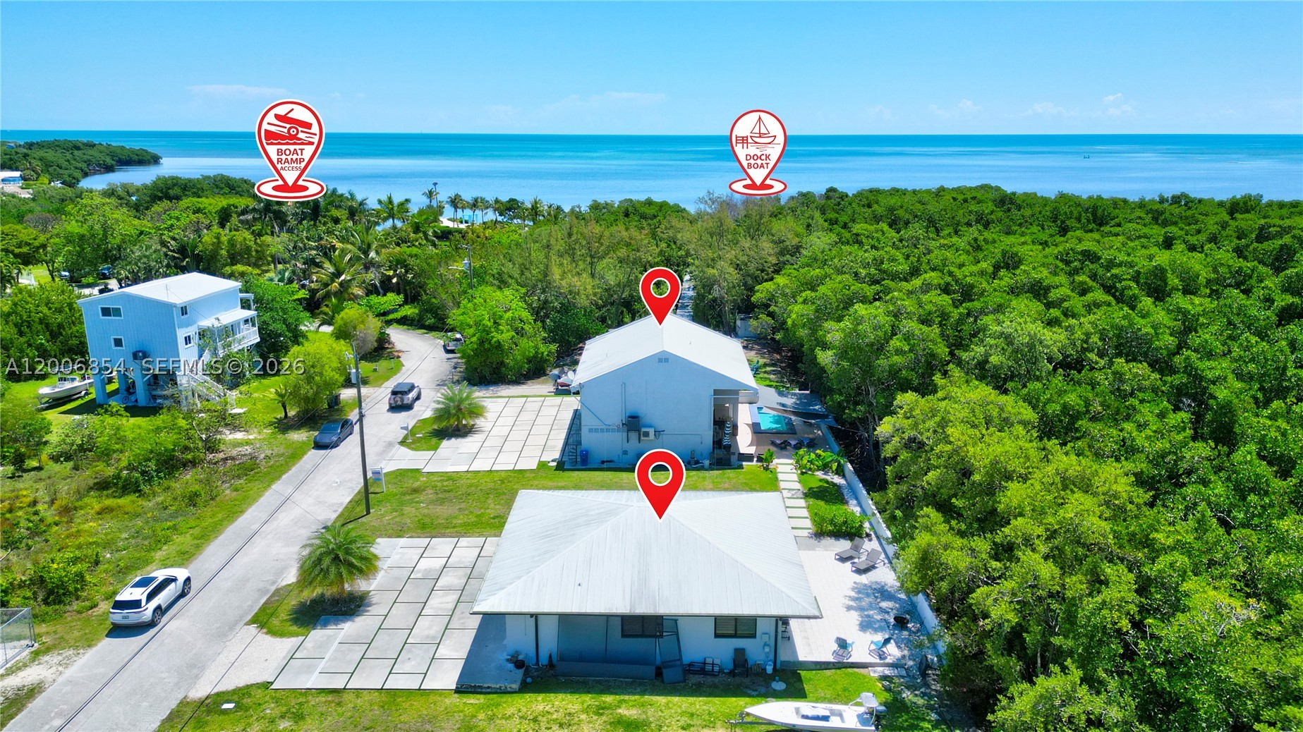 Huge Direct Oceanfront Compound — One-of-a-Kind with 276-Foot Concrete Dock
Adjacent to World-Famous John Pennekamp, Coral Reef State Park & Molasses Reef.

Discover a truly exceptional and private oceanfront compound designed for boating enthusiasts, investors, or multi-generational living. Spread across three expansive lots, this rare property includes two distinct homes and direct water access — a combination that’s nearly impossible to find in today’s market.

The primary residence features 3 bedrooms and 2 full baths, offering bright, comfortable living spaces and sweeping ocean views. The second home, complete with 2 bedrooms and 2 baths on a separate meter, is ideal for guests, extended family, or short-term rental opportunities.

Step outside to unparalleled oceanfront living with a 276-foot concrete dock, perfect for accommodating large vessels, fishing, and launching watercraft. The grounds offer generous room for entertaining, expansion, or simply enjoying the peaceful surroundings of this secluded coastal haven.

Highlights:

3 lots with two homes and a 276-ft dock
Direct ocean access — idea for boating on the Ocean or Bay.
Steps from John Pennekamp Coral Reef State Park
Perfect for entertaining, investing, or creating a family retreat
Unmatched privacy and coastal lifestyle potential.