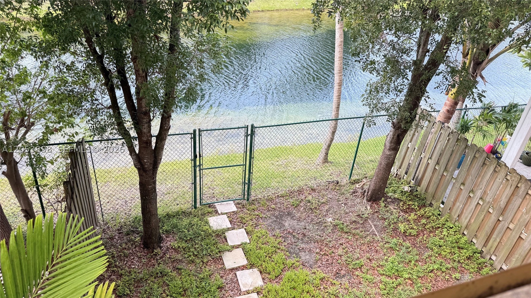 Lakefront townhouse at featuring a bright open layout, spacious bedrooms, and a private patio with peaceful lake views. Conveniently located near schools, parks, shopping, and major highways.