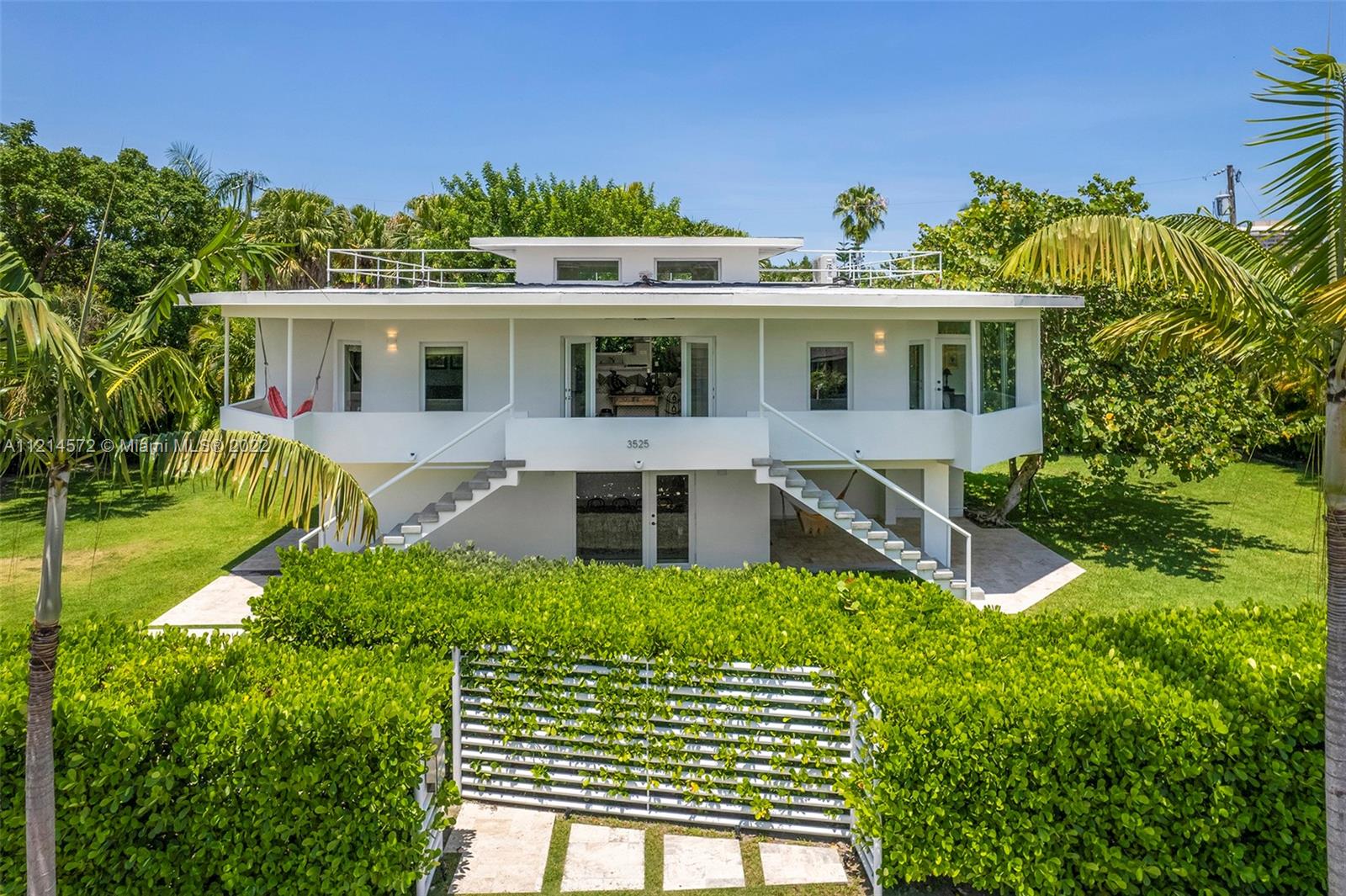 Double lot located in one of the best streets of beautiful and charming North Grove (Lot 6 & 7) with 11.600 Sq Ft.  This home is located in a high demand neighborhood which offers luxury and privacy with a road that ends on the ocean.  This two story home offers 4,300 Sq Ft of construction with 3,600 Sq Ft under A/C …  offering a concrete roof, impact windows throughout, 5 bedrooms, 4 bathrooms, 4 parking spaces, surround system throughout the entire house and a gorgeous back yard and terrace which is perfect for family life and entertaining.  Easy to show.