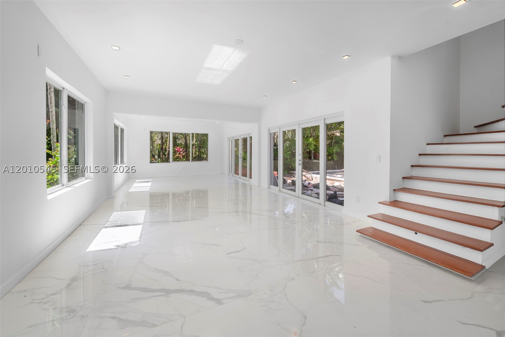 Mediterranean style two story home renovated 2025. Move in condition. Conveniently located near I-95, La Gorce Country Club, and the beaches. The interior offers generously sized rooms that are bright and functional, including formal living, dining, and family rooms. Chef’s kitchen with European cabinetry and stainless steel appliances. Additional features include high-impact glass windows and doors, marble and wood floors, a new roof, and a pool patio. Garage and plenty of parking. Don’t miss the opportunity to own this truly exceptional home, with its unique character and unbeatable location. The roof and plumbing is new. Real seller — move in now!