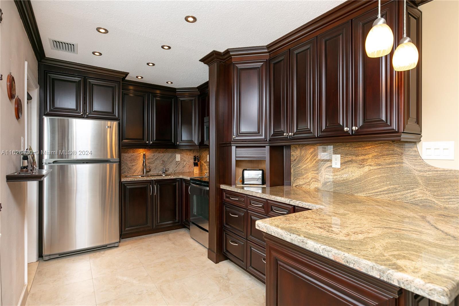 This impeccable one-bedroom, one-bathroom is a must see gem, perfectly remolded with attention to detail. Boasts a prime location across the street from the ocean. The interior features elegant kitchen with granite countertops and sleek tile flooring throughout. The impact glass ensures safety and energy efficiency, while the beautiful pool area offers a serene retreat. All updated to perfection, making it a luxurious and comfortable home or vacation spot. Don't miss the chance to own this coastal paradise! The complex is on the intercoastal waterways offering stunning views of million dollar homes and yachts traveling by. Close to Aventura Mall, Gulfstream Horse Track with Casino, and dining. Free Hallandale bus service to shopping and more.