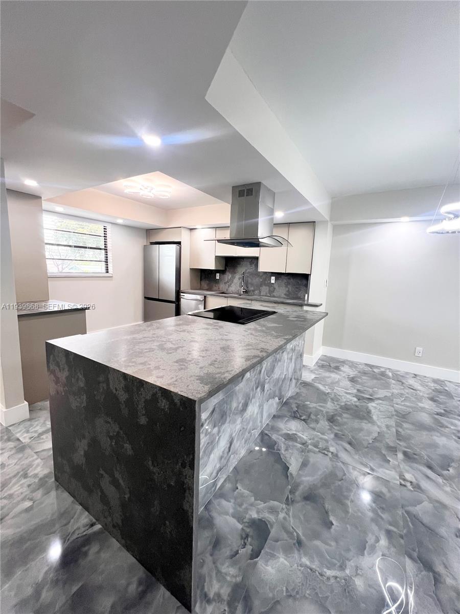 STUNNING HOME IN THE HEART OF TAMARAC. NEW ROOF NEW ELEVATOR ALL CERTIFICATIONS PASSED! 55+ CABLE INSURANCE AND INTERNET ARE INCLUDED. RETIRE IN STYLE. NEW STAINLESS STEEL APPLIANCES HAVE 2 YEAR WARRANTY. CUSTOM QUARTZ COUNTER TOPS WITH AN OPEN FLOOR PLAN AND COOKING ISLAND AWAIT ALL OF YOUR FABULOUS MEALS AND GATHERINGS. CUSTOM GORGEOUS TILE THROUGHOUT FRESHLY REMODELED HOME WITH FROSTED GLASS DOORS AS YOU WALK INTO EVERY AMAZINGLY LIT ROOM. SPACIOUS DEDICATED LAUNDRY ROOM WITH PLENTY OF STORAGE. SPA BATHROOMS WITH MODERN TOUCHES SUCH AS COLORFUL FUN WATER TEMPERATURE INDICATION! IT ALSO HAS BEAUTIFUL LAKE VIEWS. EVERYTHING IN THIS HOME IS SMART (LIKE IT'S FUTURE OWNER) FROM THE KITCHEN APPLIANCES TO THE LOCKS ON THE DOOR! THERE ARE SOME GREAT AMENITIES AS WELL PICKLE BALL GYM AND POOL!