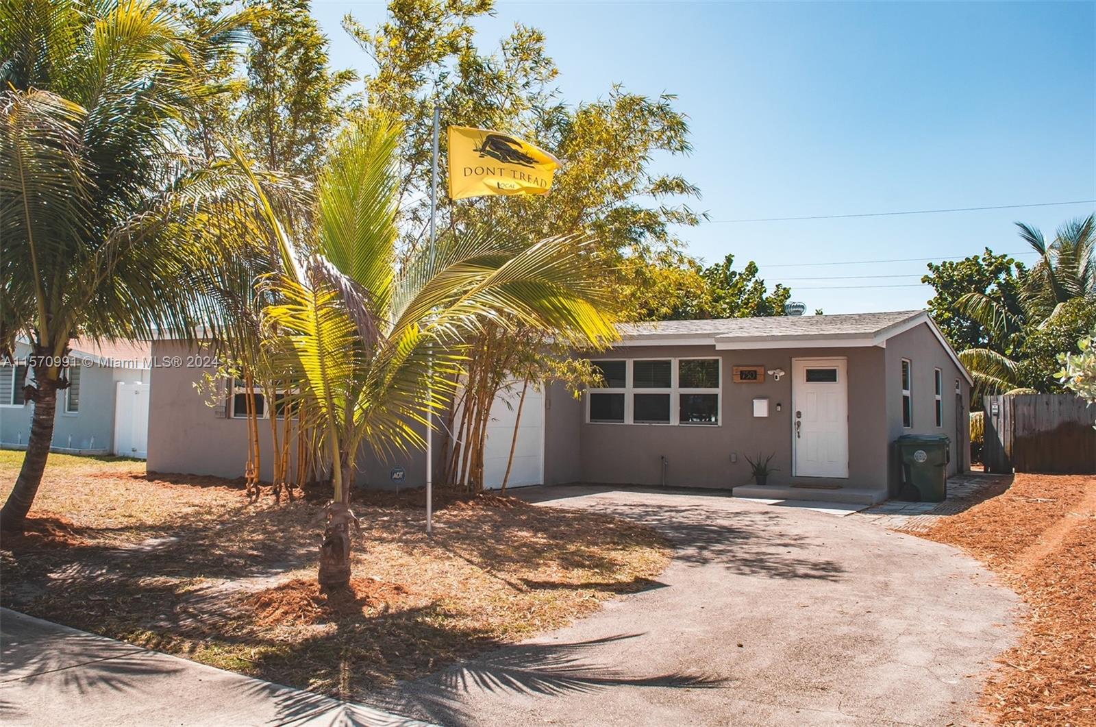 Feast your eyes on this beach home just minutes from Lauderdale by the Sea. The 2/1 features updated flooring throughout the home, a modern kitchen with quartz countertops, stainless steel appliances, and an updated bathroom. This home also comes with hurricane impact windows. Out back discover a tropical oasis that includes a tiki hut under the shade of sea grapes, a tv, bar, entertainment system, as well as mature fruit trees around the property. The house has a new roof, No HOA, and ample parking for cars, boat, or an RV. Another feature is that it is one of the few homes in the area with a garage. It is walking distance from newly built schools, close to bars, restaurants, and major highways. This property would serve as a great starter home, investment opportunity, or vacation rental.