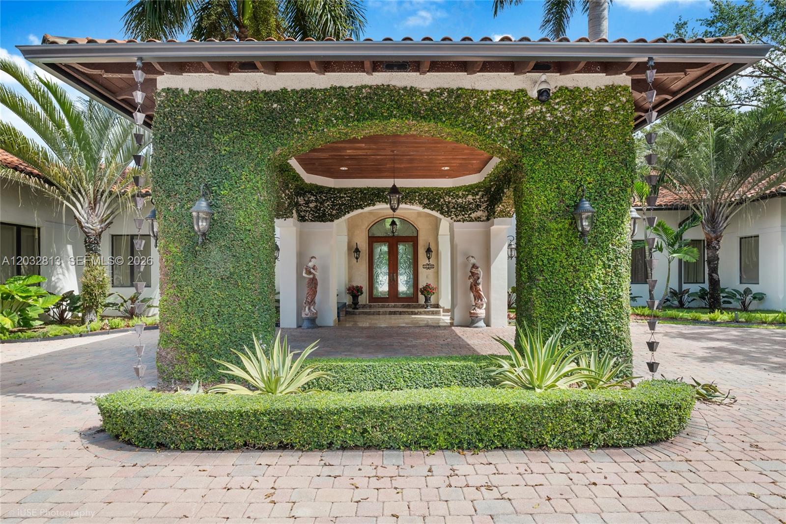 Resort-style living in Pinecrest. Located in one of the most sought-after neighborhoods and close to the area’s best schools, this stunning estate sits on over 1 acre of lush, impeccably manicured grounds. The home offers six spacious bedrooms, two staff rooms, and a beautifully designed office with a wine cellar and private entrance. Every bedroom features its own en-suite bathroom. Expansive family room and breakfast area provide views of the backyard, while a covered garage adds convenience. Enjoy a resort-style patio with a covered entertaining area, built-in BBQ, heated pool, jacuzzi, sauna, and more. A must-see luxury property