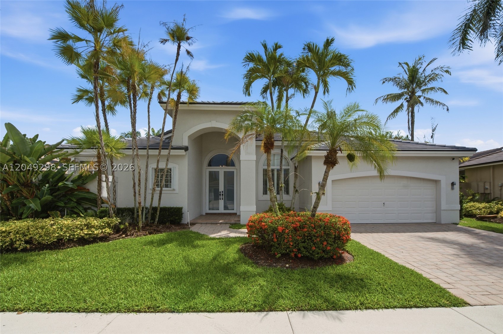 Tucked in the gated community of Eagle Run at Weston Hills Country Club on a cul-de-sac street with a royal palm-lined street. Substantial remodeling in this expansive six-bedroom, 4 full bath custom pool home. New Roof 2023; impact and Accordion shutter hurricane protection.  Fully fenced yard with a paver patio, an overhang, and a sparkling pool, surrounded by a privacy hedge. Open-concept kitchen with white Shaker cabinets, an expansive center island, and a black granite-and-marble countertop.  Stainless steel appliances, wood floors throughout living areas. Volume ceilings, extensive crown moldings. Newly renovated primary bath with a vessel tub, porcelain tile flooring, dual cabinets, and an oversized shower.  All baths renovated, neutral paint, decorator light fixtures.  This one won’t last.