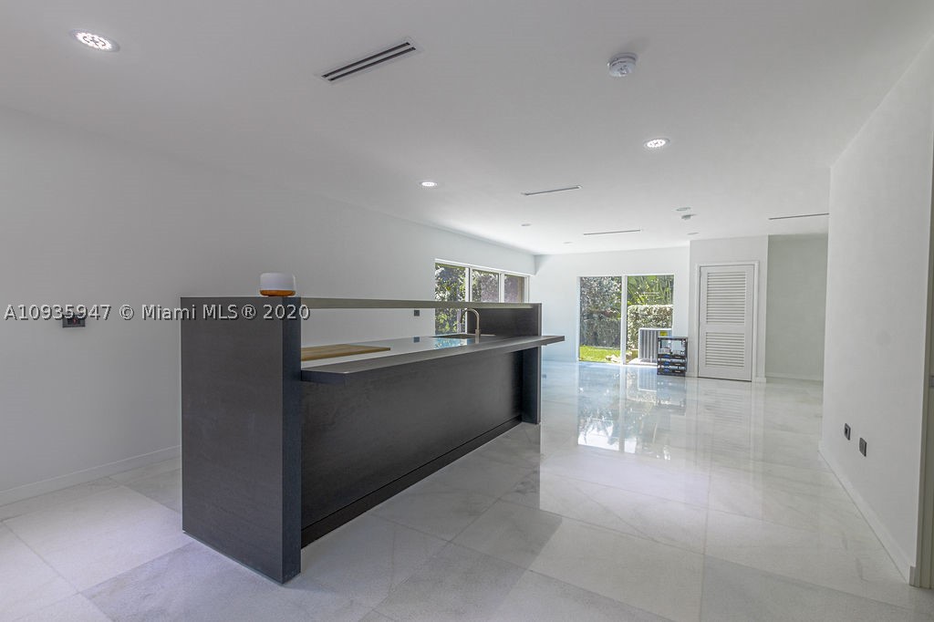Luxury Modern Estate located in the heart of Pinecrest. It features 7 bedrooms, 7 bathroom and 2 powder. Open layout with full of natural light throughout, double height ceilings, marble floor, walk-in wine cellar. Italian kitchen w/Wolf and Subzero appliances. Impressive backyard and terrace perfect for entertainment with summer kitchen and grill, infinity heated pool, Jacuzzi and guest house. Oversized master suite with an extra large walking closet, incredible bathroom and panic room. 2 laundry rooms, family room, studio overlooking the outdoor area and 4 car garage. Easy access to major expressway and very close to the best schools in the area.