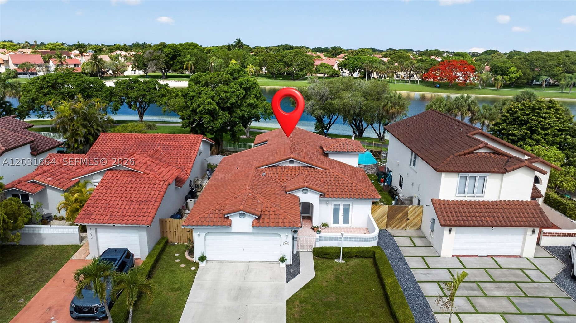 Beautiful lakefront 3-bedroom, 2-bathroom home located in a desirable West Kendall neighborhood. This residence features a bright and spacious floor plan with vaulted ceilings, multiple living areas, and a functional layout. The kitchen offers ample cabinetry, generous counter space, and a breakfast area overlooking the family room. The home also features a impact windows and doors.

The primary suite includes a walk-in closet and private bath. Step outside to enjoy a large fenced backyard with breathtaking lake views, plenty of green space, and room for outdoor gatherings.

Additional features include a 2-car garage, dedicated laundry room, and a spacious driveway. Conveniently located near top-rated schools, shopping, dining, parks, and major roadways. Don't miss this opportunity to own a waterfront home in one of West Kendall's most sought-after locations.