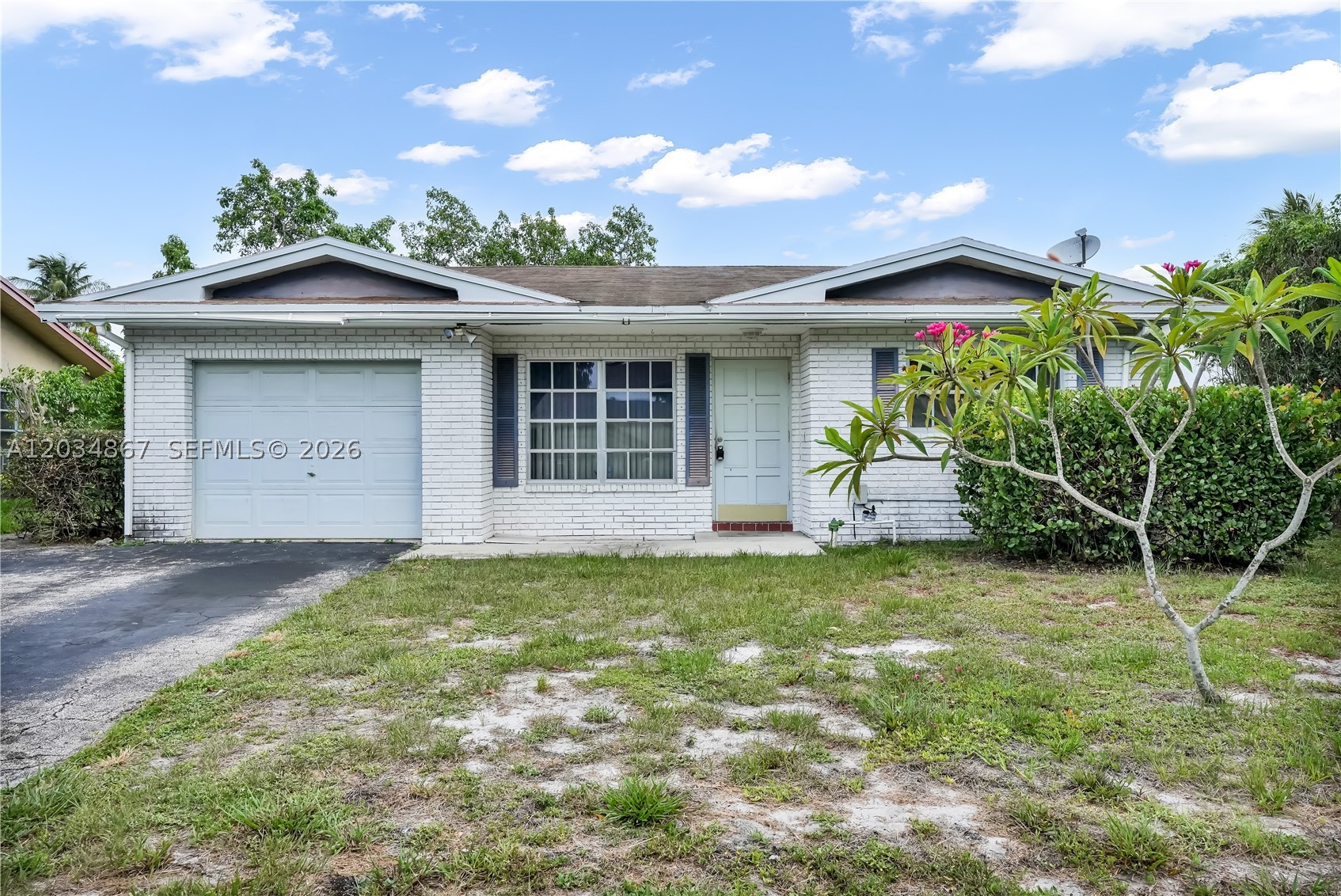 INVESTOR SPECIAL! Rare opportunity to own a 2-bedroom, 2-bath single-family home with a garage in the desirable Palm Aire area. This property sits on a spacious 6,588 SF lot and offers excellent potential for investors,  or buyers looking to create a customized modern residence. With a functional layout, ample outdoor space, and plenty of room for improvements, this home is a true blank canvas waiting for transformation.
Bring your vision and turn this property into a modern gem with added value. Ideally located near shopping, dining, major roadways, and local amenities. Property is being sold AS-IS. Great opportunity for those looking for a renovation project with upside potential.