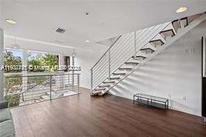 LUXURY THREE LEVEL TOWNHOME. 13 ft ceilings, $28,400 in reserves, sleek modern design, private rooftop terrace, private terraces on every floor, two covered parking spaces, gated entry, striking glass enclosed flex space top deck, spectacular panoramic views of South Beach, half a block to Lincoln road. Very easy to show!