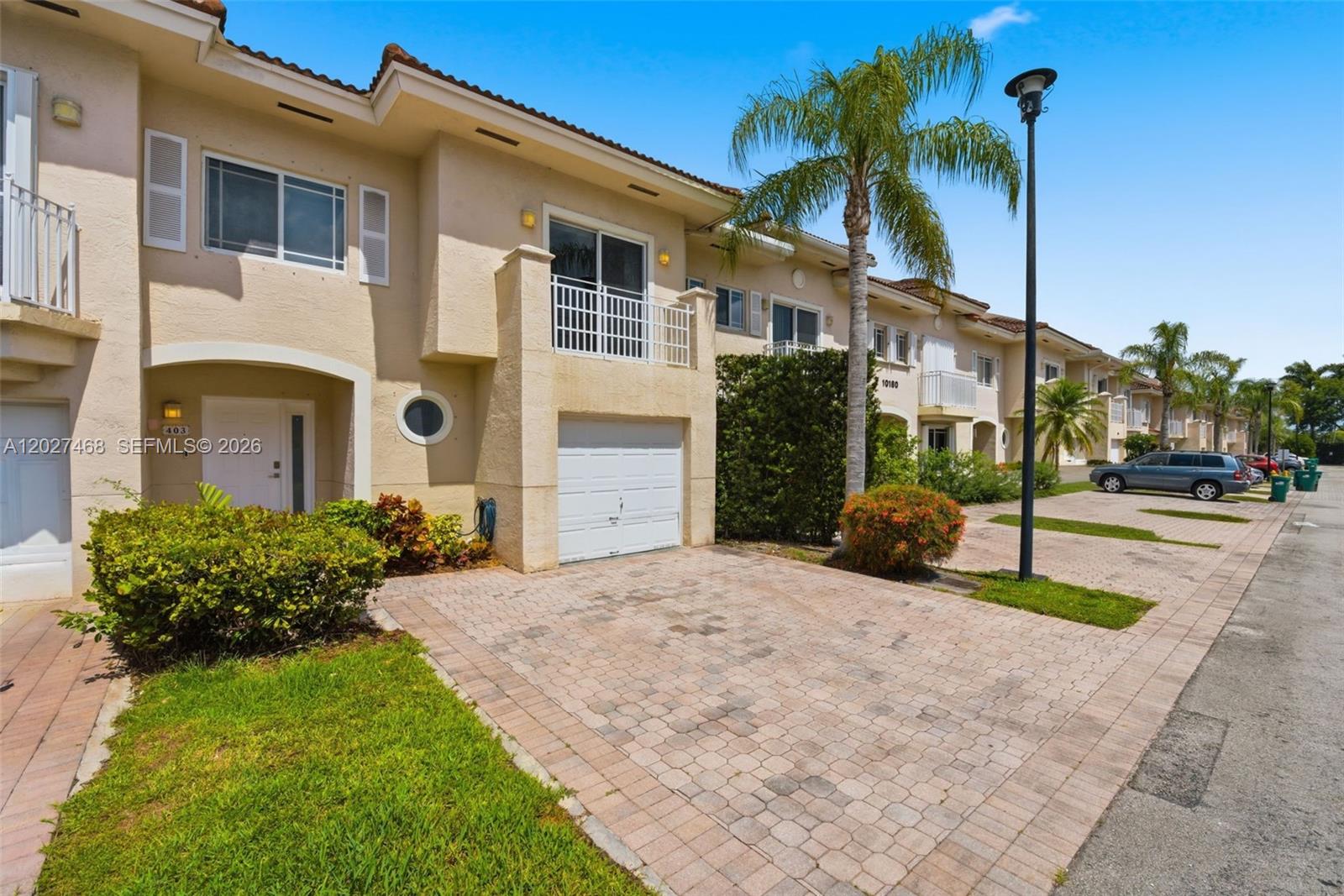 Beautifully kept town home in East Kendall.  Located in the gated community of Tiffany, this 2 story home features an attached garage and full bath on the ground level.  The private backyard is ideal for indoor/outdoor living.  Upstairs,  you'll find 2 generous bedrooms with great closet space that share a bathroom.  The master suite boasts vaulted ceilings and a completely remodeled bathroom.