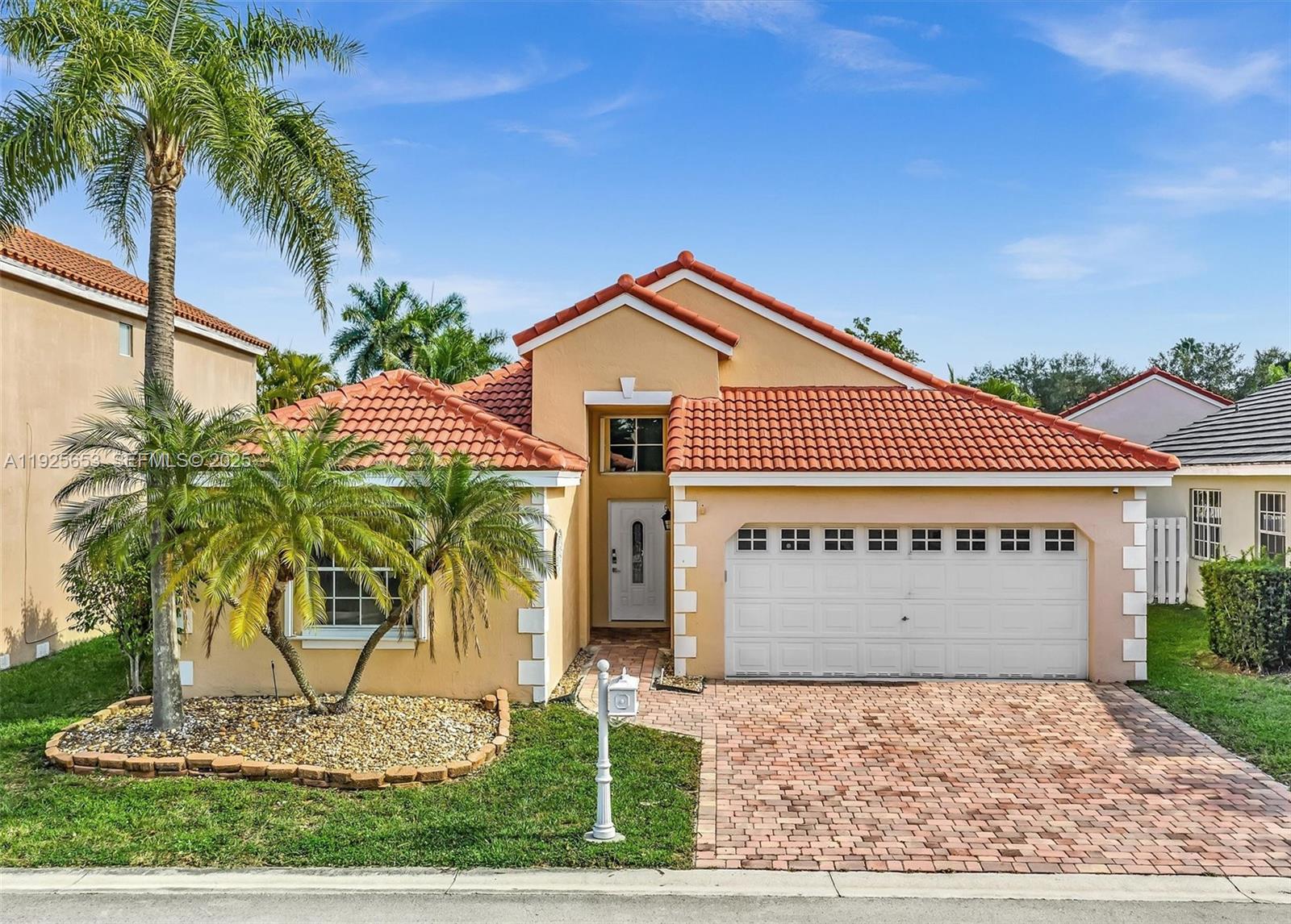 Set in the charming neighborhood of Bermuda Springs on a cul-de-sac street, this charming one story home opens to a bright great room, giving the house an open and spacious feel. The center island kitchen, equipped with ample cabinetry, an induction cooktop, a smart-panel stainless steel refrigerator and granite countertops, is designed for everyday cooking and casual dining. The primary suite features a walk-in closet with built-ins and bathroom with dual sinks and a separate tub and shower. The split bedroom floor plan adds privacy with the additional 2 bedrooms and tastefully remodeled second bath on the other side of the house. Step outside and enjoy outdoor living on the covered and tiled patio which overlooks the fully fenced yard. Additional features include vaulted ceilings, laundry room with full size washer and dryer, paver entry walkway and driveway. Accordion shutters for hurricane ease and peace of mind. ROOF 2023! Gated community with amenities which include a pool, playground and basketball ct. Zoned for top-rated schools. Easy access to major highways, shopping, beaches and parks.