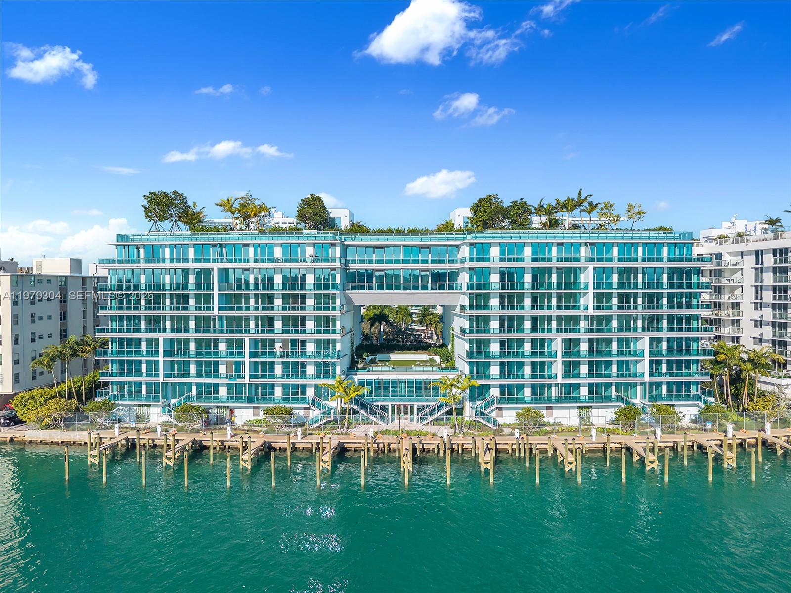 Lower Penthouse Unit 710 at the newly completed waterfront development La Baia South on Bay Harbor Island. This sun-filled unit offers beautiful bay and sunset views and features a well-designed layout with 2 bedrooms and 2.5 bathrooms. The modern kitchen includes premium Miele appliances. Enjoy stunning amenities including a rooftop with 360° views, infinity-edge pool, multiple lounge, dining and BBQ areas, plus club and fitness rooms. Great location within walking distance to the beach, shopping, and restaurants. Boat slips available for purchase or lease.