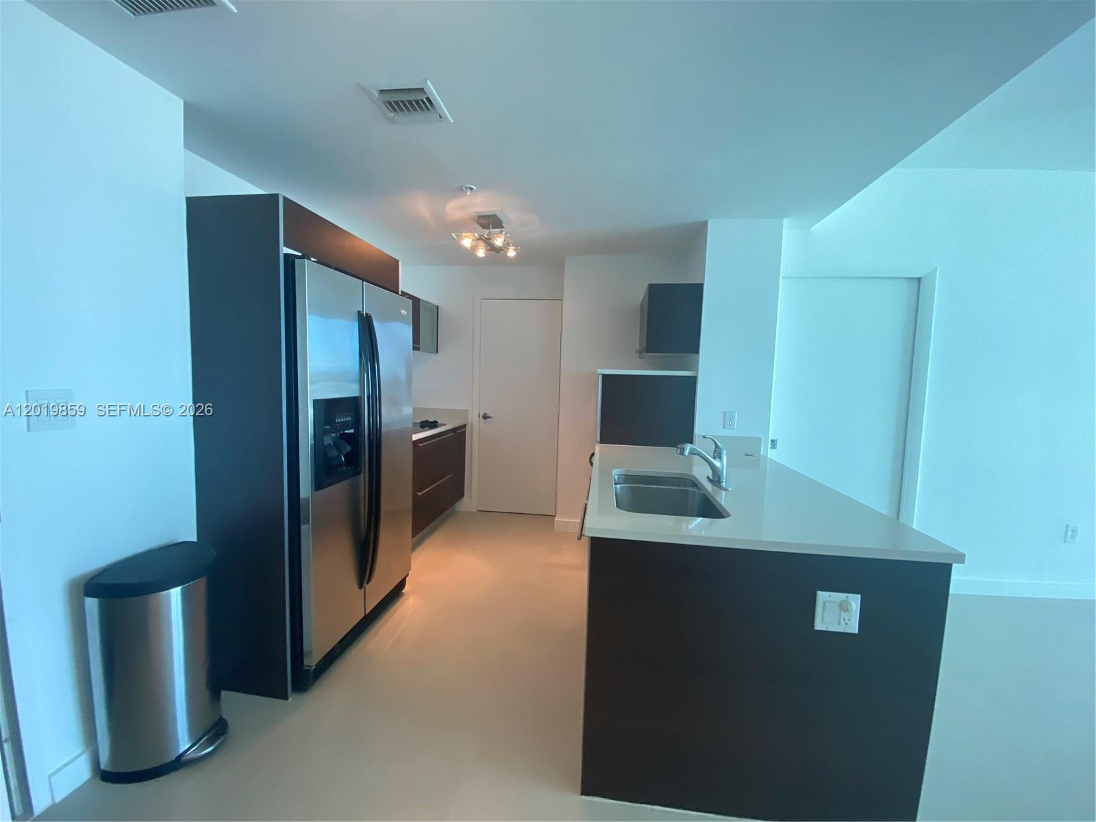 Great unit available at Quantum on the Bay! This stunning property features 1 bedroom, 1.5 bathrooms, and a spacious den with a closet that can easily be used as a second bedroom or a home office. The unit boasts porcelain floors throughout, a brand-new washer and dryer, stainless steel appliances, and a large balcony with beautiful city views. Located directly across from Margaret Pace Park, you are just minutes away from the airport, premier shops, and restaurants. Best of all, the building is approved for low down payment options!