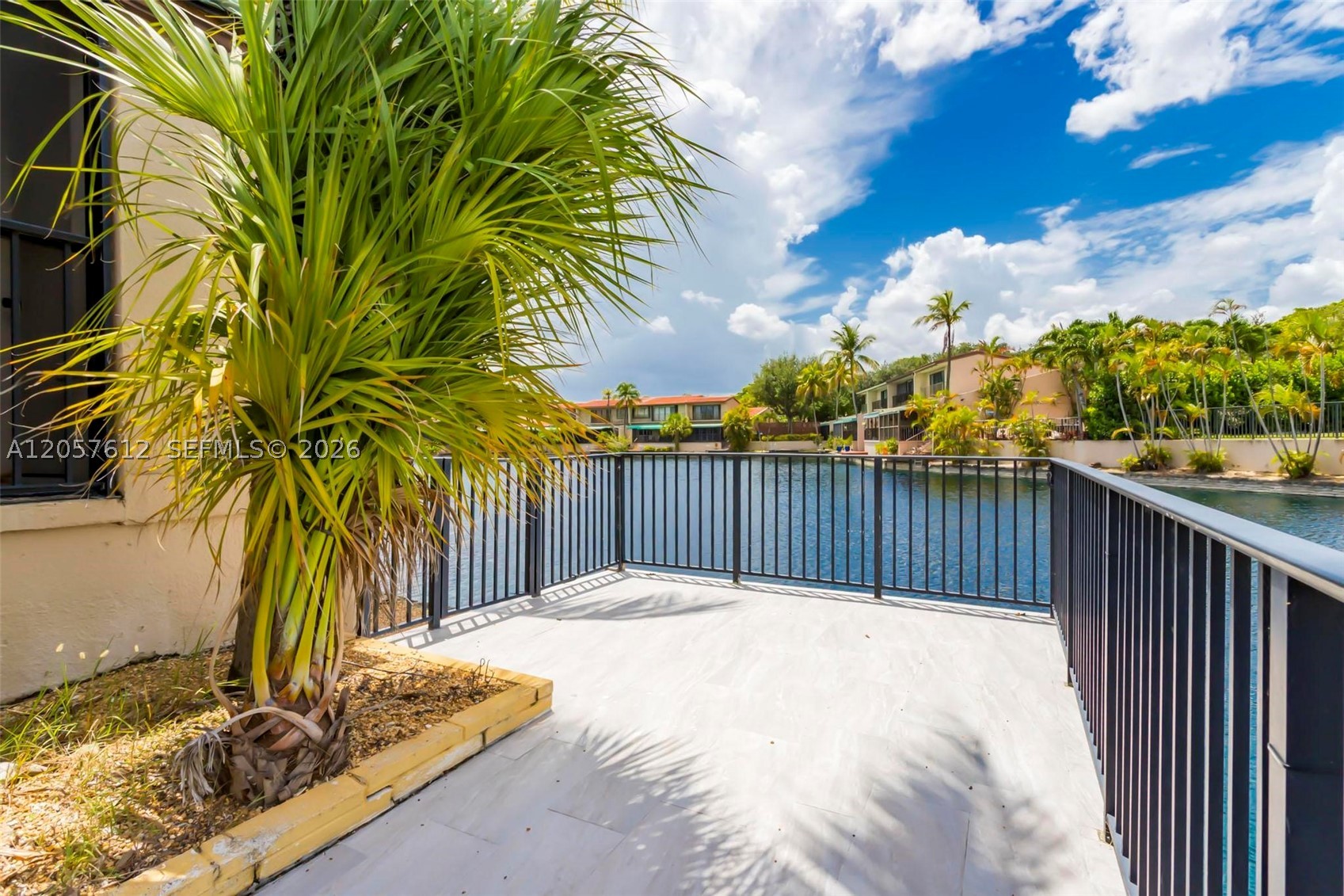 Beautifully renovated corner townhome in a quiet, gated Miami Lakes community! This lakefront residence features 2 bedrooms, 2.5 bathrooms, a versatile loft, a welcoming foyer, a dramatic spiral staircase, and bright, open living spaces. The updated kitchen offers custom cabinetry, high-end appliances, and granite waterfall countertops. Enjoy peaceful water views and the added privacy of a spacious corner lot. Conveniently located near parks, shopping, dining, schools, and major highways. A wonderful opportunity to experience resort-style living in the heart of Miami Lakes!