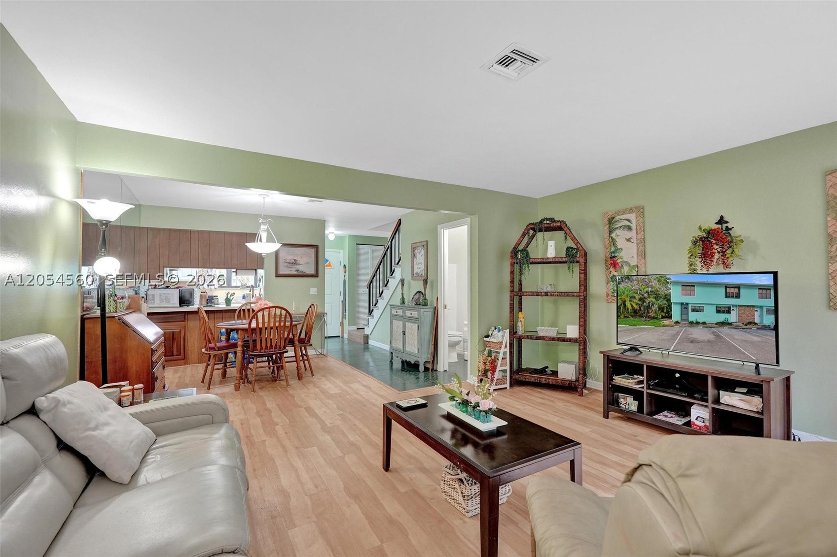 Rare opportunity to own one of the most desirable units in the community. This updated corner residence offers extra privacy with no neighbor on one side, an additional window that fills the home with natural light, and the only private patio in the entire development. Conveniently located with easy access to your assigned parking space—no tight turns—and plenty of guest parking nearby.

The first floor features an open kitchen, spacious living/family room, and a full bath. Upstairs you'll find two bedrooms and two full baths, including a private primary suite.

The HOA covers landscaping, garbage, high-speed internet, exterior insurance, and exterior maintenance. All roofs were replaced last year. This well-managed, fully funded waterfront community offers beautifully maintained grounds, a resort-style pool and spa, gas grill, tiki-style gathering area, day dock for fishing, and even a private white sand beach on the bay. Just minutes from downtown Jensen Beach, waterfront dining, shopping, and only 7 minutes to the Atlantic Ocean. See it once... you'll want to stay.