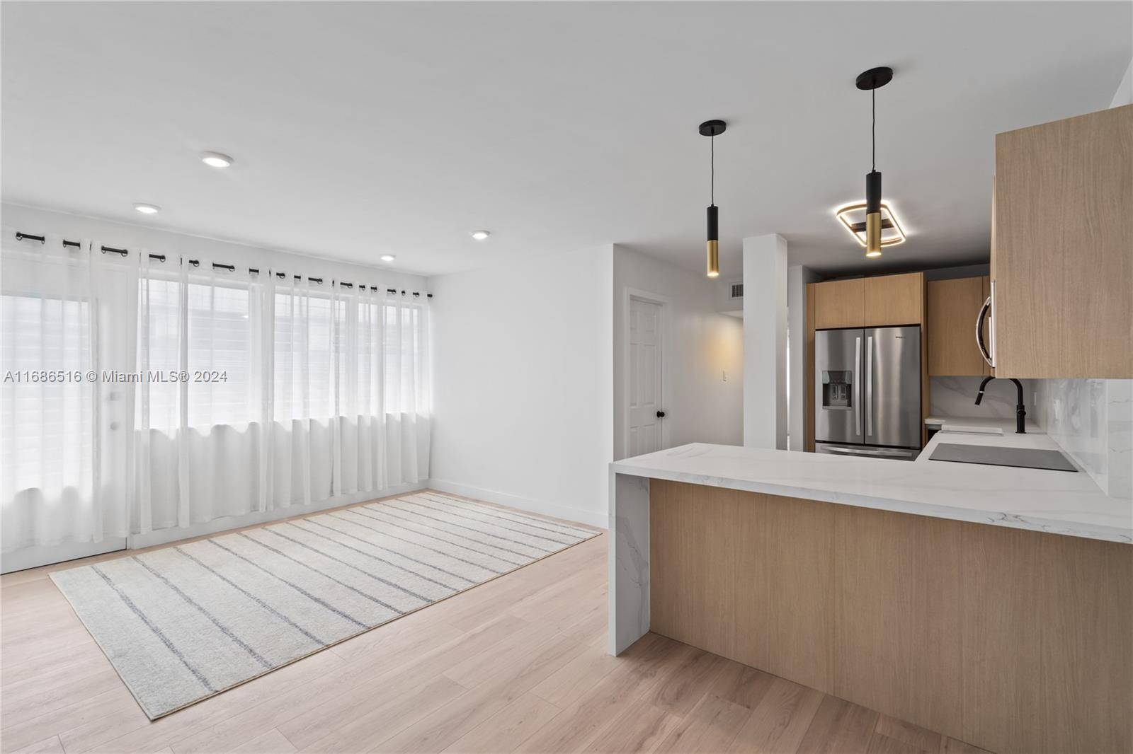 Newly renovated, this corner penthouse-level residence features a modern design with a 1-bedroom
layout plus a den. Located across from the Bay, Flamingo Park, The Mondrian, & top dining experiences. No expense spared in the meticulous renovation, where every element was thoughtfully curated. The sleek, modern kitchen features state-of-the-art appliances & chic finishes tailored for discerning taste. Expansive wrap-around balcony & an additional balcony accessible from BR. Owner installed tankless water heater & in-unit washer/dryer, ensuring utmost convenience & luxury. Offers pool, gated/covered parking & communal storage space. Immerse yourself in the vibrant ambiance of the neighborhood & embrace the coastal lifestyle, with
the beach just a stroll away.