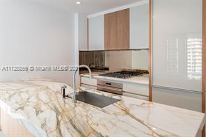 Beautiful corner unit with spacious floor plan with great view of Biscayne Bay and Coconut Grove marina. Master Bedroom with great master bath, 2 bedrooms with jack and jill bathroom and 1 guest bath. High end appliances Sub-Zero and Wolf with marble countertops. Great amenities, Fitness Center, roof top pool, children's play area, movie theater, 24-hour concierge, sauna and steam rooms. Great location in Coconut Grove a block away from Cocowalk Shopping mall, restaurants, parks, schools and marina.