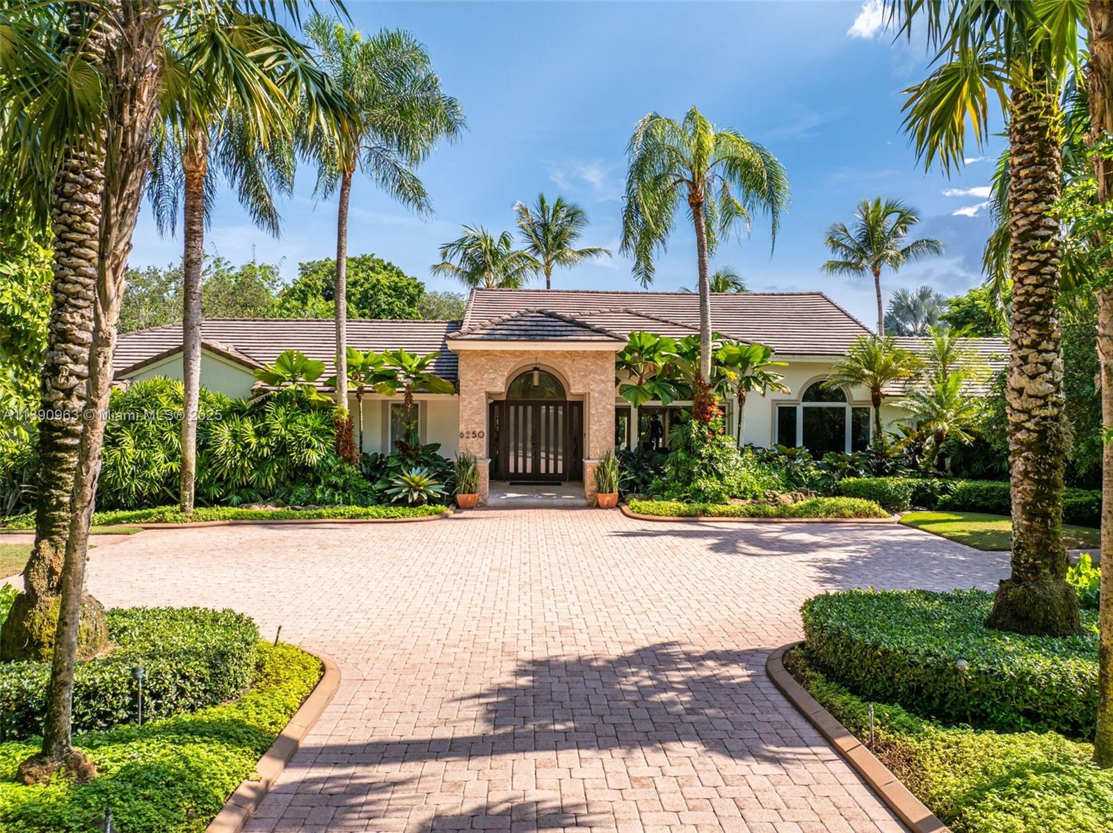 Where everyday living meets a vacation state of mind. This single-story Pinecrest estate blends family living with resort-style fun on a builder’s acre. High ceilings & a wide-open floor plan flow seamlessly to expansive outdoor spaces with covered patio, pool & spa, waterfalls, koi pond, fountains, lush landscaping, putting green, chickee hut, & summer kitchen. Inside, a national award-winning 11-seat theater with kitchenette, wine cooler, & snack cabinet makes movie night effortless. The 7,735 sq ft move-in ready layout includes 6 spacious bedrooms, an office, & 6 full + 2 half baths, anchored by a chef’s kitchen with Thermador & Sub-Zero appliances. Whole-house generator, impact windows, 2013 roof, & 2-car garage provide lasting comfort in one of Miami’s most desirable neighborhoods.