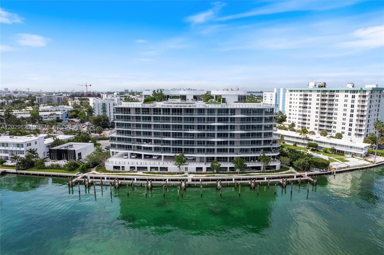 GREAT OPPORTUNITY! Unit 203 at Onda Residences in Bay Harbor Islands is an elegant 3 bedroom, 3.5-bathroom plus den home with 2,333 sq. ft. of living space. Designed with exquisite Italian craftsmanship, it features Snaidero cabinetry, Miele appliances, and marble bathrooms, Italian porcelain flooring throughout. The unit boasts high ceilings with large sun-drenched windows and an open floor plan. Onda provides residents with exceptional services and amenities, including a rooftop pool and jacuzzi, a private marina, a state-of-the-art gym and spa with steam and sauna, 24-hour valet and security, personalized concierge services, and secured residential storage. The building also offers electric vehicle charging stations. Walking distance to world renowned Bal Harbour Shops and beaches!