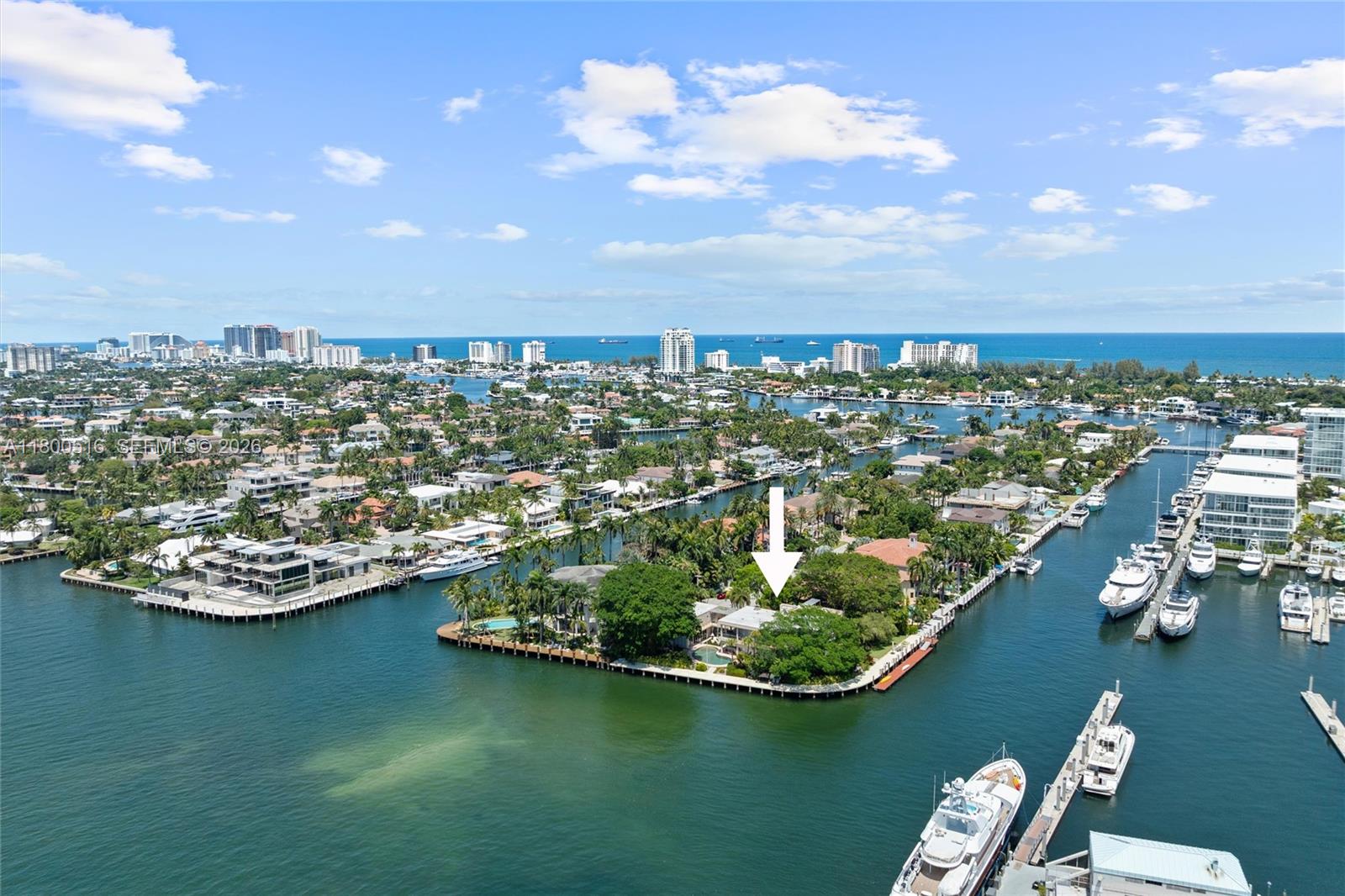 This one of a kind, Intracoastal trophy point lot estate in highly desirable Harbor Beach features up to 8 bedrooms, 6.5 baths, 300+/- feet of waterfront with spectacular views and one of the best docks in Fort Lauderdale.  The marble clad residence plus guest house/captain’s quarters offers super yacht dockage for a 100+ vessel on the south side while preserving wide water Intracoastal views on the west side.  5 minutes to Port Everglades Inlet.  Mature banyan trees and tropical landscaping surround the property and give it a private, resort like feel.  The living areas flow seamlessly to the pool and outdoor living spaces and the property is ideally suited for large scale entertaining.  The primary suite features 2 bedrooms and spectacular Intracoastal views.