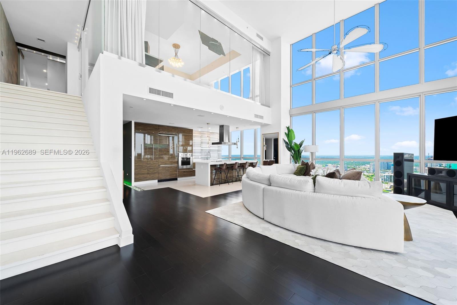 Exceptional corner 4-bedroom, 4.5-bathroom 2-story Sky Residence at Marquis offering some of the most breathtaking views in the city. Spanning two levels with soaring 20 foot ceilings and an excellent layout. Enjoy direct water views overlooking Biscayne Bay and Miami Beach. Warm and inviting interiors open to a massive balcony, professionally designed for comfort and entertaining. Prime location with close proximity to Miami Beach and Brickell, delivering the ultimate elevated Miami lifestyle.
