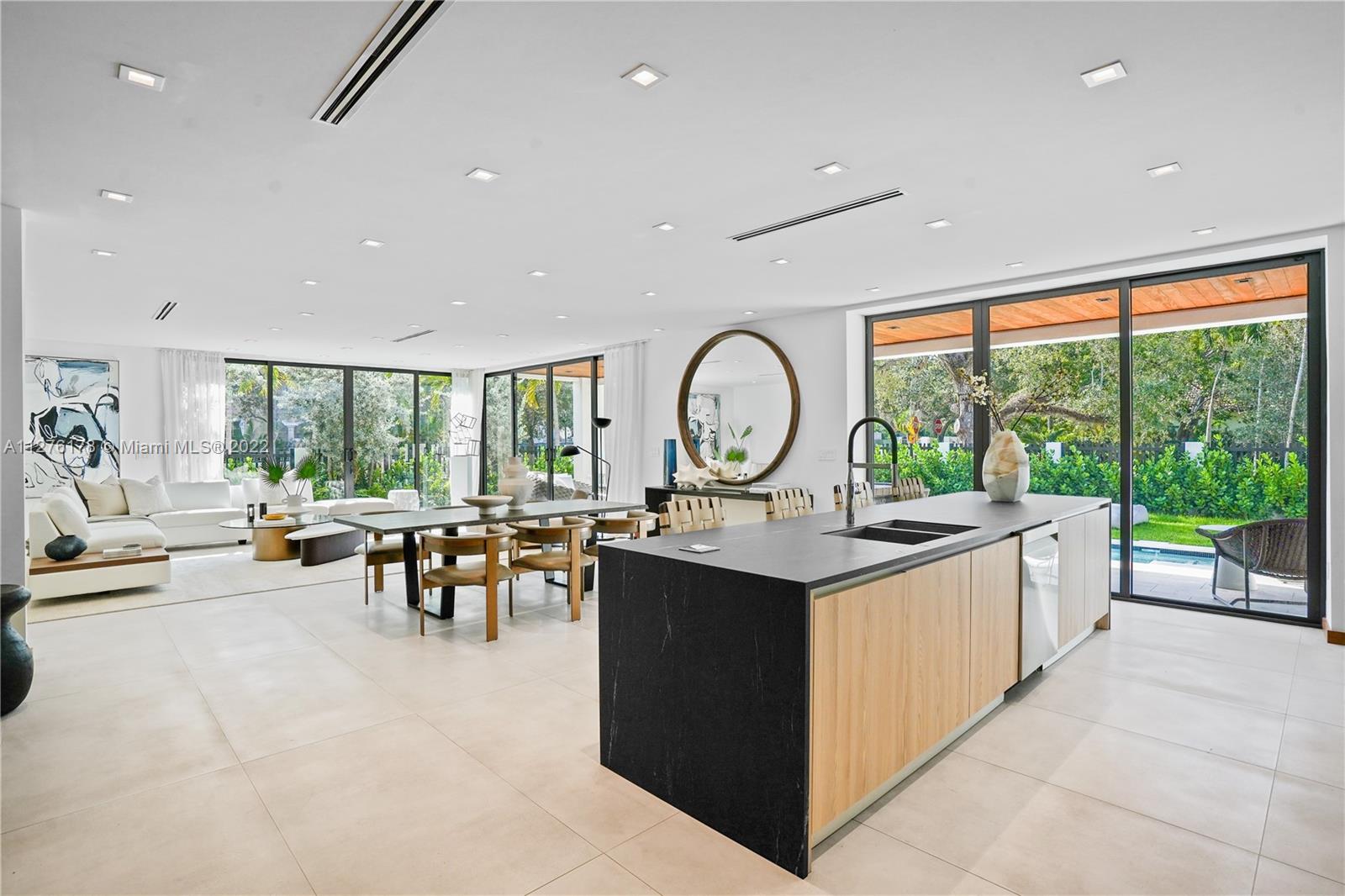 Stunning, brand new home exquisitely designed combining stone, porcelain, and wood elements within a beautiful 4,650sqft interior space.  The house contains 5 spacious bedrooms each with its own bathroom and features a wide open floor plan with a kitchen overlooking the living and dining room. Additional features also include floor-to-ceiling windows allowing an abundance of natural light, a sleek, modern pool & spa, expansive second story terrace, and gated entry. Situated on a corner lot along the historic Tigertail Ave, the shops and restaurants in Downtown Coconut Grove along with the best schools in Miami are just 2 minutes away.