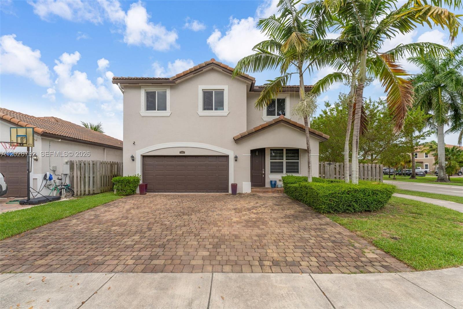 CASH OR CREATIVE FINANCING ONLY | CORNER LOT | Here is the opportunity savvy buyers have been waiting for. This massive 5-bedroom, 3-bathroom home with a 2-car garage sits on a corner lot in one of Homestead's most desirable communities — Hemingway Point — home to one of the lowest HOAs in the state of Florida at an average of just $16 per month. The home is being sold AS-IS and priced at a discount to reflect it — the master bathroom is currently demoed, making traditional financing a non-starter, which means less competition and more opportunity for the right buyer. A bedroom and full bathroom on the first floor add flexibility for guests, in-laws, or multi-generational living. The backyard is a blank canvas — pool, pergola, outdoor kitchen — bring your vision and make it your own. Bones, size, location, and price point are all here. Cash or creative financing only. The buyer who moves fast wins on this one.