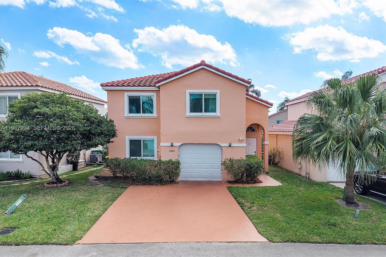 Stunning fully renovated waterfront two-story home in the highly desirable gated community of Sheridan Ocean Club. This 3-bedroom, 2.5-bath residence offers modern design and comfortable South Florida living. Soaring vaulted ceilings and abundant natural light enhance the spacious living area. The open kitchen features quartz countertops, stainless steel appliances, ample cabinetry, a large counter, and breakfast area—ideal for daily living and entertaining. The primary suite offers a walk-in closet and private balcony with peaceful lake views. Secondary bedrooms include generous closets, and a guest bath is conveniently located on the first floor. Additional features include luxury vinyl flooring throughout, fully renovated bathrooms, 1-car garage, and extended driveway for 2 more vehicles. Enjoy the large screened patio, perfect for relaxing or entertaining. Major upgrades include a new roof (2022) and impact windows and doors. Community amenities include clubhouse, pool, tiki hut, and BBQ area. Prime location just one mile from the beach and minutes to Fort Lauderdale-Hollywood International Airport, major highways, shopping, and dining. Mortgage savings may be available for buyers of this listing.