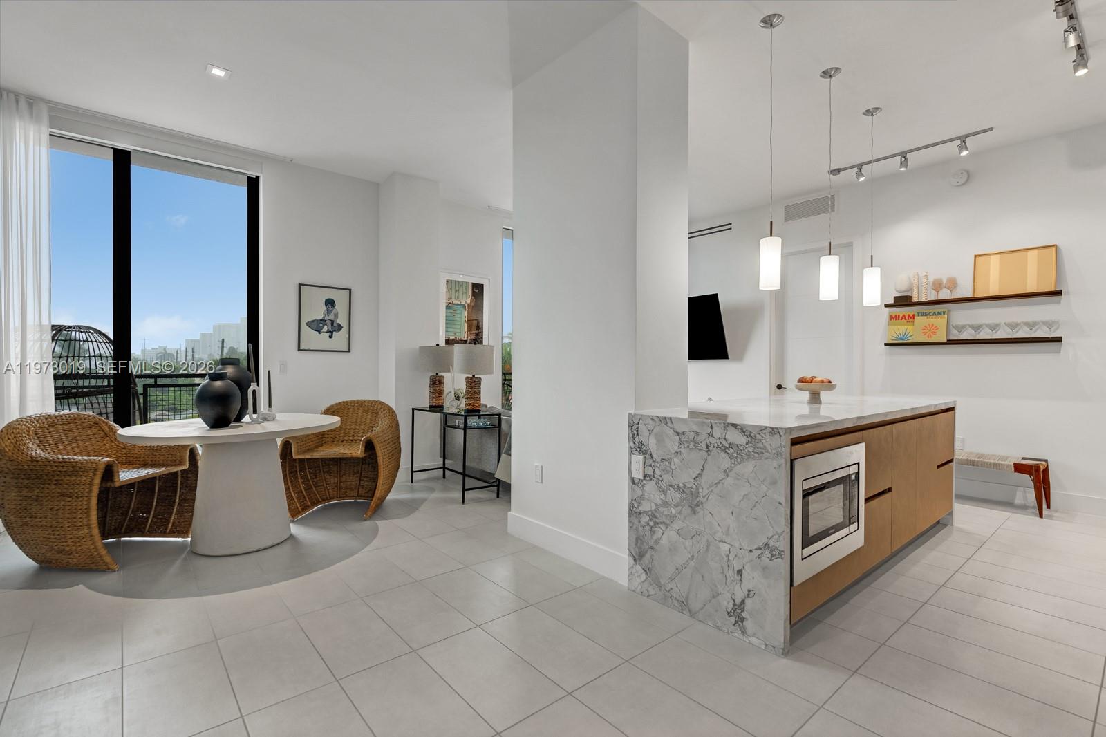 Turnkey Penthouse at Ten30 now available for sale. This bright and spacious residence features 2 large bedrooms plus an expansive den, all with generous walk-in closets. The open living area flows seamlessly into a cozy kitchen appointed with marble countertops and custom cabinetry.

Entertain effortlessly and take in stunning views from the oversized private balconies and have the opportunity to build out your own private rooftop lounge. Experience luxurious boutique living in an exceptionally secure, fingerprint-access building offering a rooftop lounge with grilling station and dipping pool.

Ideally located just moments from Lincoln Road, the Venetian Causeway, and Ocean Drive, with quick access to the mainland and major highways. The unit includes 2 covered parking spaces in a gated lot.