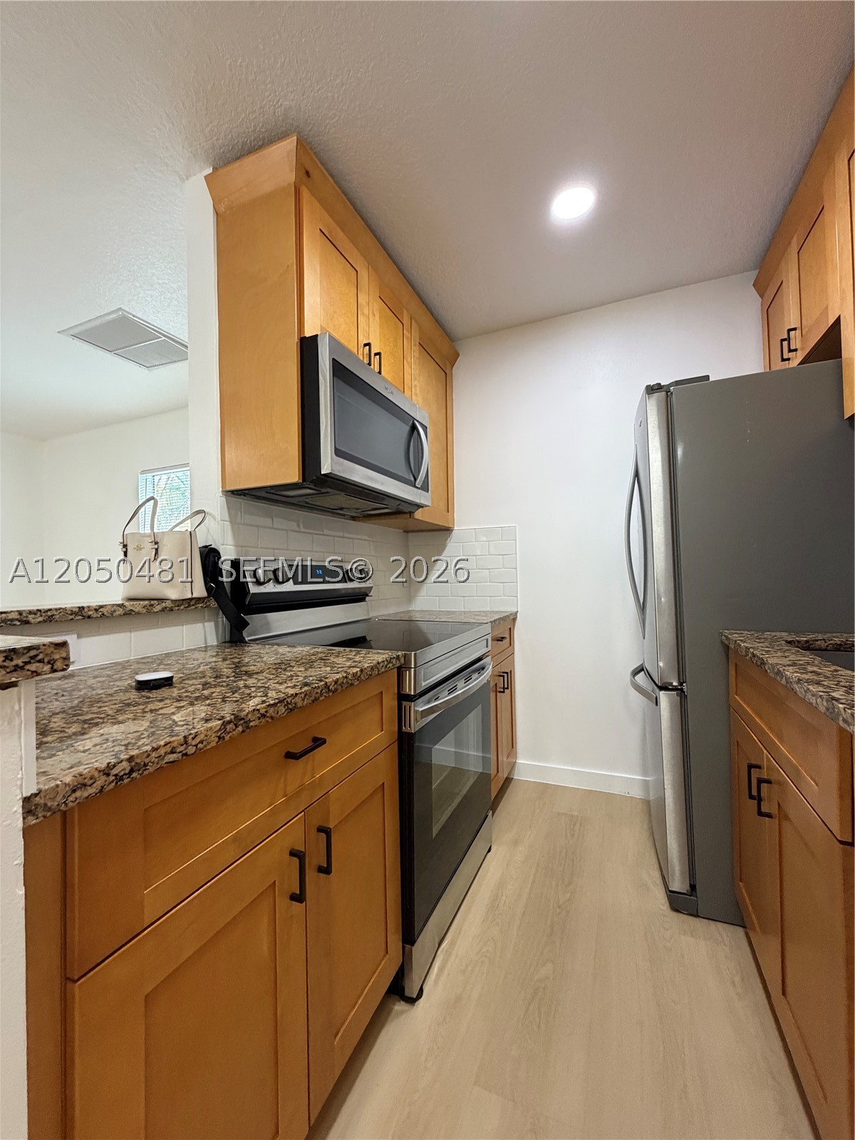 Beautifully remodeled 2-bedroom, 2-bath residence offering 953 sq. ft. of comfortable living space. This move-in ready home features a private entrance, modern finishes throughout, spacious living areas, and abundant natural light. The community offers excellent amenities, including a swimming pool, tennis courts, and beautifully maintained common areas. The property includes one assigned parking space with plenty of additional guest parking available. Located less than 15 minutes from the beach, with easy access to major highways, shopping, dining, parks, and entertainment. Seller will pay the full special assessment at closing, providing significant value and peace of mind to the buyer. Whether you’re looking for a primary residence, vacation home, or investment opportunity, this property is a must-see. Schedule your private showing today!