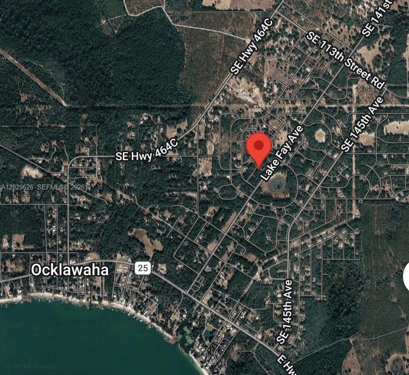 Discover your perfect building site in Ocklawaha with this prime 0.23-acre lot in the established Silver Springs Shores subdivision. Zoned R-1, this parcel is ideal for your future site-built or modular home. Located on SE Magnolia Drive Ln, this high and dry lot features a flat, near-rectangular 80' x 123' envelope, situated in FEMA Flood Zone X for peace of mind. You’ll enjoy a natural treed canopy providing privacy while being minutes away from the recreational corridor of Lake Weir, 25 minutes from Silver Springs State Park, and 30 minutes from The Villages and Ocala. Benefit from paved road frontage and proximity to active residential builds. With low annual taxes of $155 and easy access to local utilities, this is a fantastic investment. Sold as-is, 14–21 day closing. Buyer to verify all requirements with Marion County. Don't miss this opportunity!