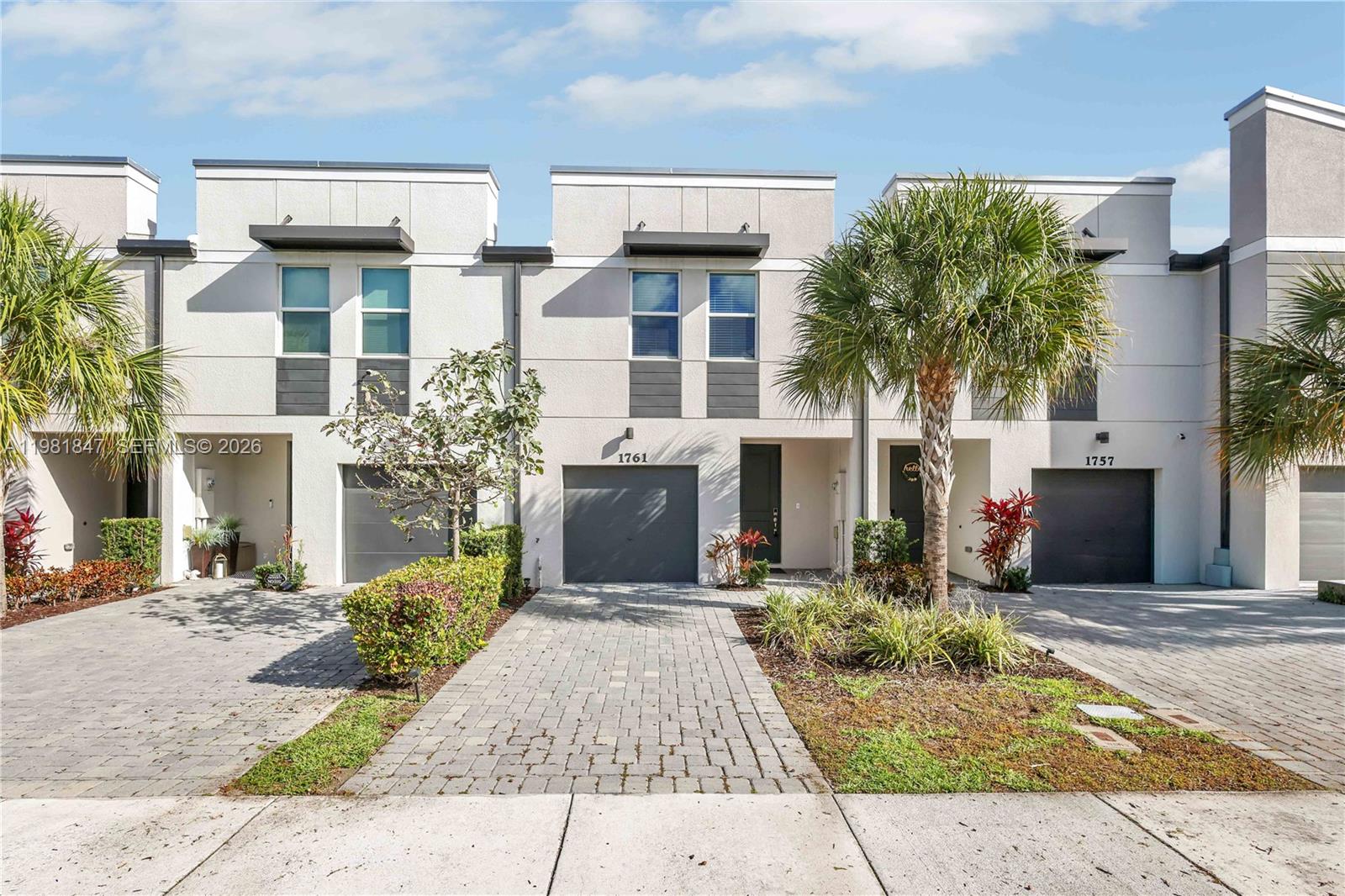 LAKE VIEW!!! Welcome to this beautifully well maintained 3 Bedroom, 2.5 Bathroom townhome built in 2022, offering modern comfort and a functional layout in a desirable gated community. This home features hurricane impact windows and doors, providing added safety, energy efficiency, and peace of mind. The open concept first floor features tile flooring throughout the main living areas, creating a bright and inviting space perfect for both everyday living and entertaining. The kitchen is equipped with newer stainless steel appliances, modern cabinetry, and ample counter space. Upstairs, you’ll find comfortable carpet flooring throughout the bedrooms along with a versatile loft area that can easily serve as a home office, kids’ play area, or additional lounge space. The spacious primary suite offers privacy and comfort with its own bathroom and generous walk-in closet space. Laundry room is located upstairs for convenience. Enjoy peaceful lake views from the home, creating a relaxing atmosphere to unwind after a long day. Residents also benefit from community amenities including a community pool, all within the security and convenience of a gated neighborhood. This newer townhome combines modern construction, flexible living space, and great community amenities, making it an excellent place to call home. LOW HOA!!!