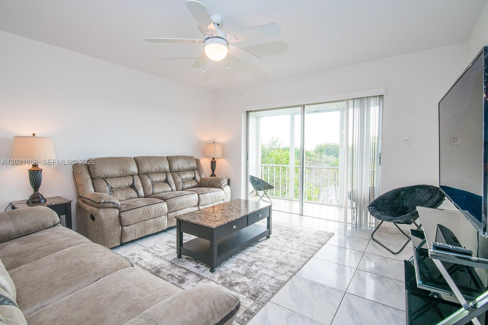 Discover this beautifully maintained turnkey-furnished 2-bedroom, 2-bath penthouse condo located on the top (5th) floor of an elevator building. This bright and airy residence features an open-concept layout with sliding glass doors that flood the living space with natural light and open to an oversized screened balcony overlooking tranquil garden and pool views. The updated kitchen offers granite countertops, a double refrigerator, and abundant cabinet storage. Tile flooring runs throughout the home, complemented by generously sized bedrooms. The spacious primary suite includes a vanity area and walk-in shower, while the guest bath features a tub/shower combination. Ideally situated near downtown Hollywood, the Seminole Hard Rock Hotel & Casino, plus premier shopping, dining, and entertainment. Just bring your suitcase and start enjoying the South Florida lifestyle!