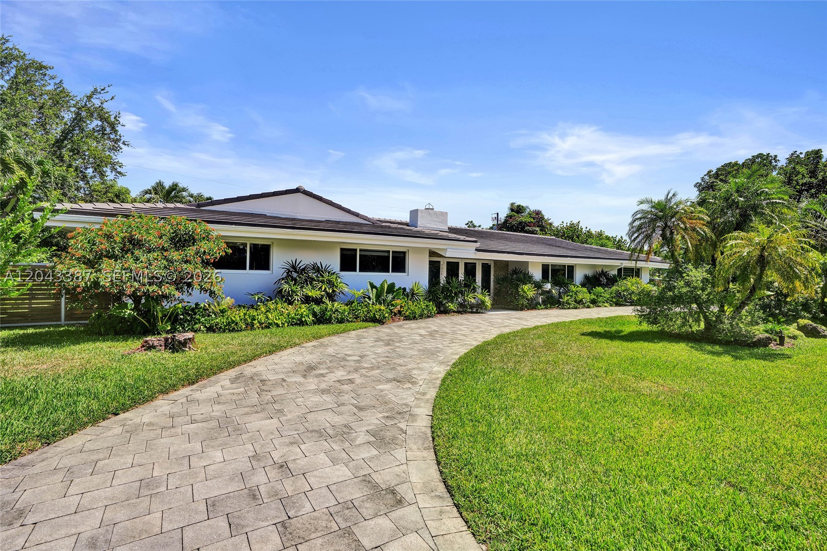 Exquisite turnkey residence nestled on a tranquil street in highly desirable Pinecrest, just moments from premier dining, entertainment, and shopping at The Falls. This exceptional home offers the perfect balance of modern sophistication and warmth, with thoughtful design elements creating a comfortable and inviting “lived-in” ambiance. Beyond the elegant double-door entry, a grand foyer welcomes you into an expansive open-concept living space featuring a charming wood-burning fireplace, a stunning chef’s kitchen with custom cabinetry, quartz countertops, and stainless-steel appliances, all complemented by breathtaking views overlooking the sparkling pool. The 4-bedroom, 3-bath residence showcases a luxurious primary suite complete with his-and-her walk-in closets, custom closet systems, ample storage, and beautifully appointed bathrooms. Designed with entertaining in mind, the outdoor oasis features a heated pool surrounded by lush, manicured landscaping, a serene fishpond feature, and ambient lighting—creating the perfect setting for unforgettable gatherings with family and friends.

Modern upgrades include roof, impact windows, new kitchen with custom cabinetry, quartz countertops and stainless-steel appliances, heated pool, and limestone patio deck. Impressive in every detail and truly a pleasure to show.