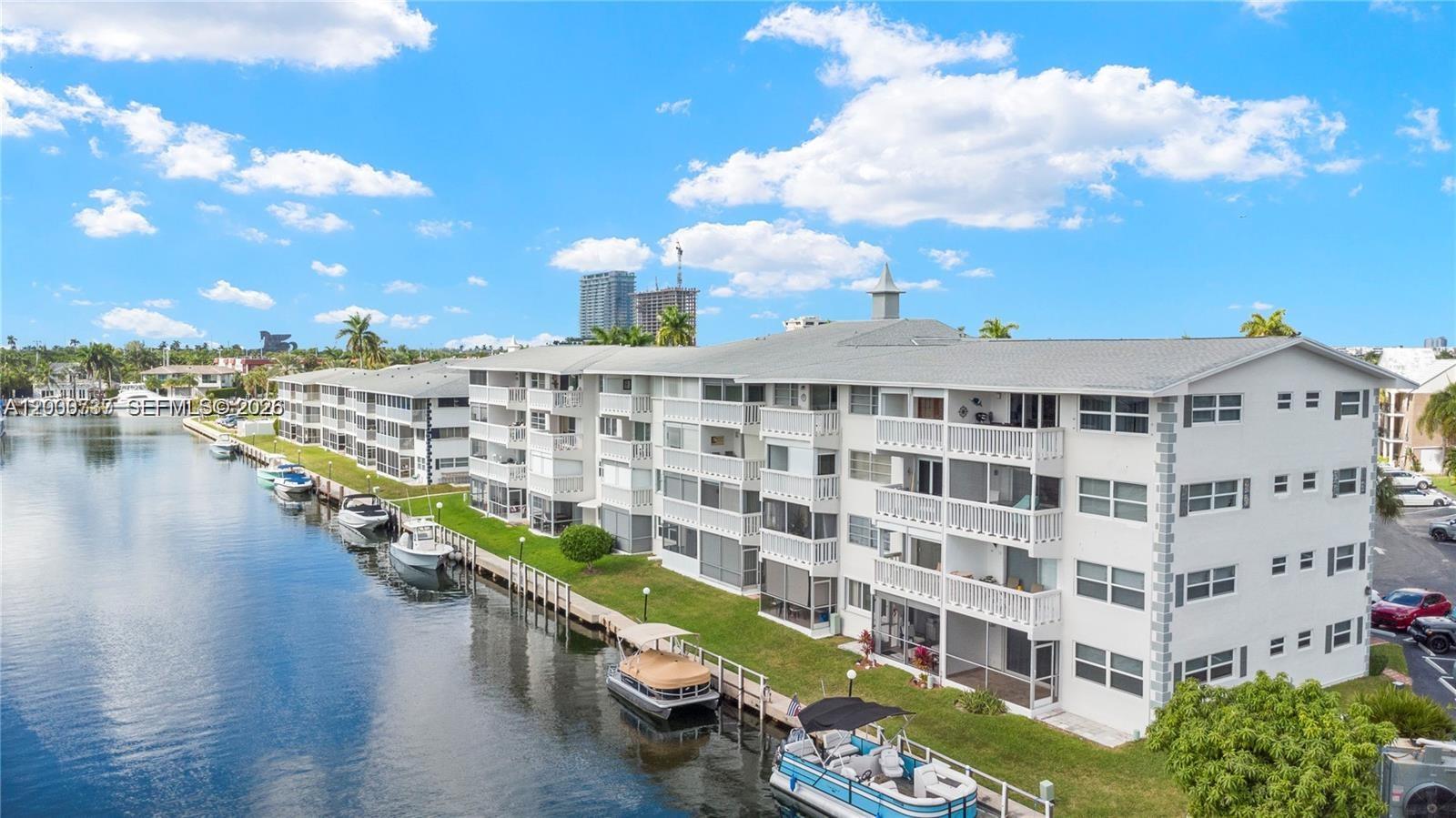 BOATERS DREAM! 1 BEDROOM 1 BATH WITH CANAL VIEWS Experience island living at its finest! This furnished 1-bed, 1-bath waterfront unit offers spacious interiors, an open kitchen, and a large screened balcony with stunning water views. Perfect for relaxation or entertaining, it features assigned parking, on-site laundry, and storage. Accordion shutters ensure hurricane readiness. Enjoy resort-style amenities like the community pool, shuffleboard, clubhouse, and BBQ area. With the beach, shopping, and dining just minutes away, this is an unbeatable opportunity to own a slice of paradise.