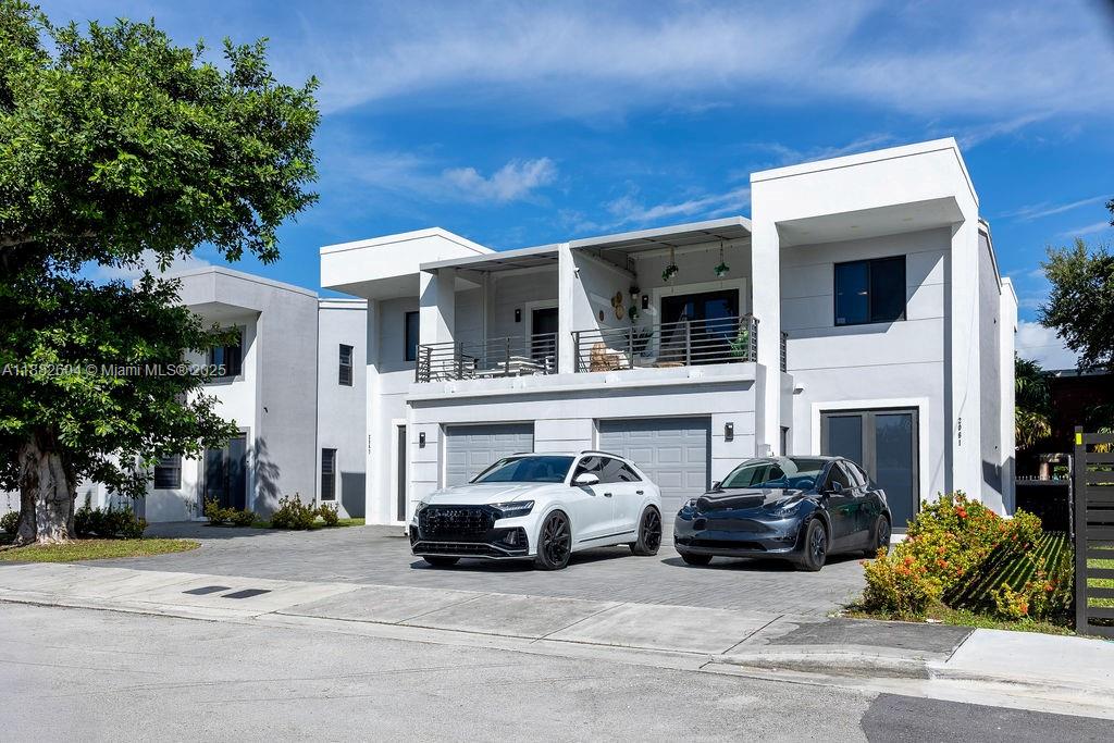 Stunning, immaculate, centrally-located two-story condo, featuring spacious open living area, modern finishes, three bedrooms on second floor.  Lots of outdoor living space - 2 balconies, and a patio. Small community of 4 units in total. Tremendous opportunity.