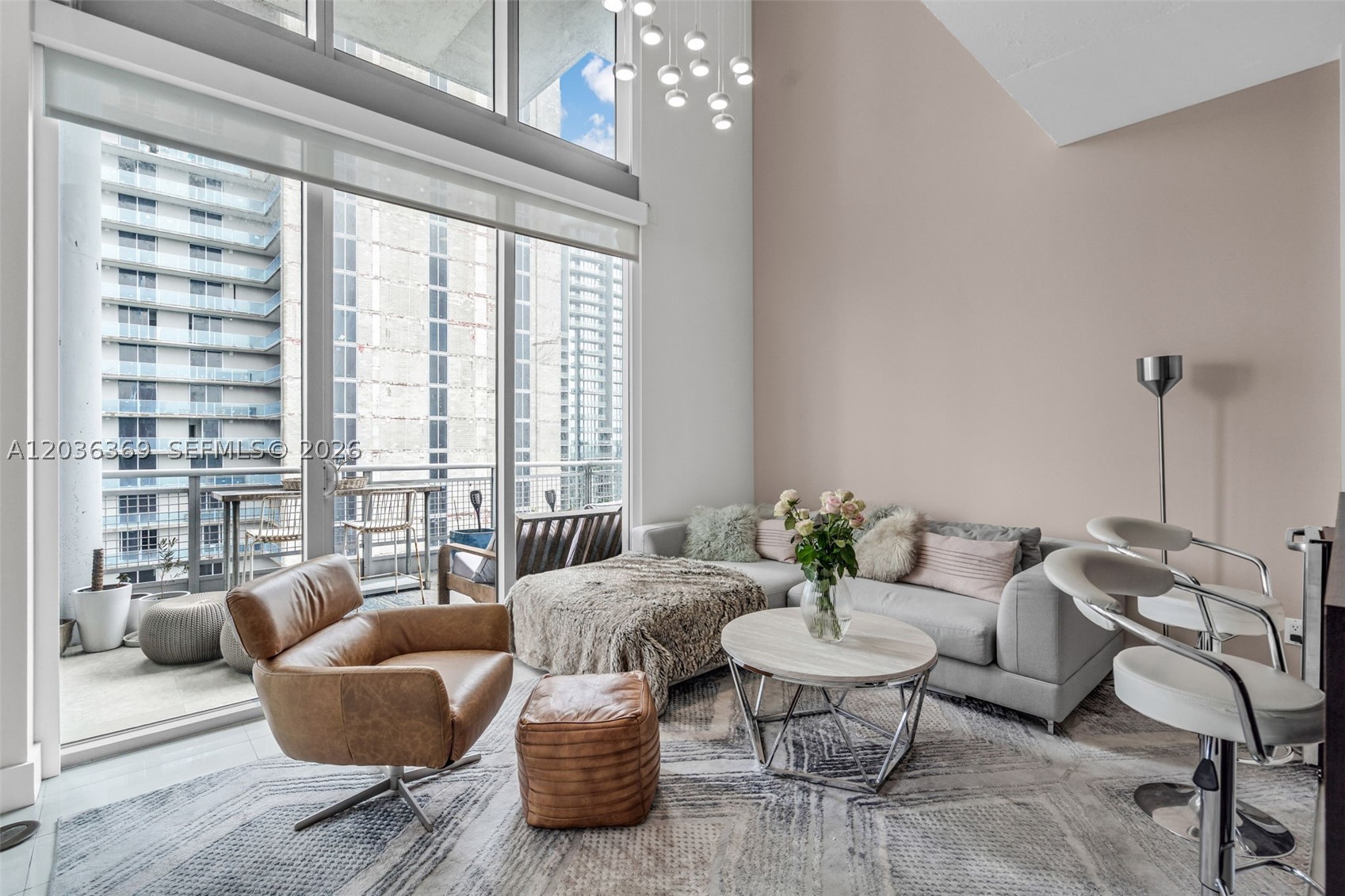 PH II-16 at Neo Vertika in Brickell is a modern penthouse with a loft-like feel, high ceilings, and floor-to-ceiling windows that bring in abundant natural light and showcase open city views. The layout is ideal for comfortable everyday living and entertaining, featuring an open living and dining area and a functional kitchen. Located in the heart of Brickell, just steps from top dining, cafés, shopping, and Miami’s vibrant urban lifestyle.