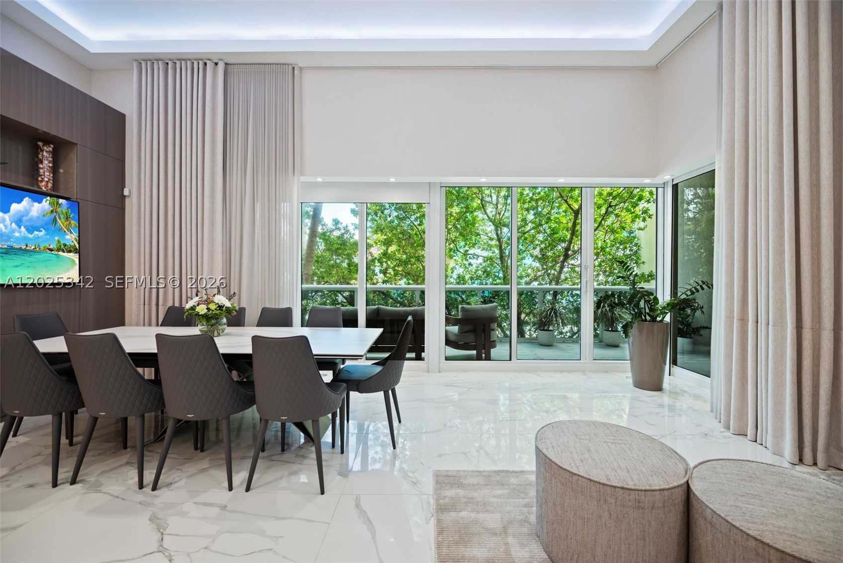 Experience elevated oceanfront living in this fully reimagined designer residence at the prestigious Beach Club in Hallandale Beach. This stunning home blends modern sophistication with resort-style luxury, featuring soaring double-height ceilings, oversized porcelain flooring, custom lighting, and expansive living spaces filled with natural light. The sleek chef’s kitchen is a true centerpiece with custom cabinetry, premium integrated appliances, and a dramatic waterfall island designed for both entertaining and everyday living. Floor-to-ceiling glass doors open to a private terrace surrounded by lush tropical landscaping, creating the perfect indoor-outdoor South Florida lifestyle.
The residence also features a spectacular custom-built walk-in closet, spa-inspired finishes, and impeccable attention to detail throughout. Located in one of South Florida’s premier oceanfront resorts, residents enjoy access to world-class amenities including a full-service luxury spa, oceanfront fitness center with state-of-the-art equipment, resort-style pools, private beach service, valet, concierge, café, 24-hour security, and five-star hotel-style services.
Perfectly positioned between Miami and Fort Lauderdale, the Beach Club offers unparalleled convenience just minutes from Aventura Mall, Bal Harbour Shops, Gulfstream Park, fine dining, luxury shopping, and private aviation. A rare opportunity to own a turnkey residence in one of South Florida’s most sought-after beachfront communities.