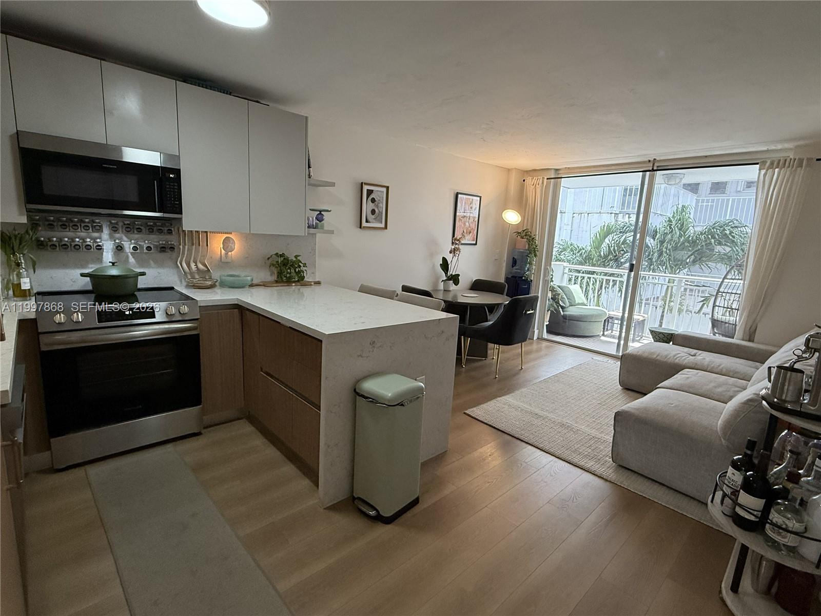Ideal SoBe location. 2bed/2bath at West Bay Gardens condo. Recently renovated bathrooms, kitchen cabinets, countertops & dining island. New top of the line appliances + paneled refrigerator offering a seamless styled look.  Premium neutral tone wood flooring, impact windows, central A/C, oversized walk-in closet. Quiet and safest building in the area with Low HOA funded with reserves providing courtyard pool & seating areas, gated covered parking, additional scooter parking, private storage and common laundry rooms with 2 washer/dryers per floor. Located at desired West Ave/Bay- Lincoln Road Rd cul-de-sac next to the new walking bridge to Sunset Harbour/Purdy Ave area, Belle Isle and famous Venetian Islands causeway. Steps to Trader Joes and Lincoln Road mall promenade to the ocean.
